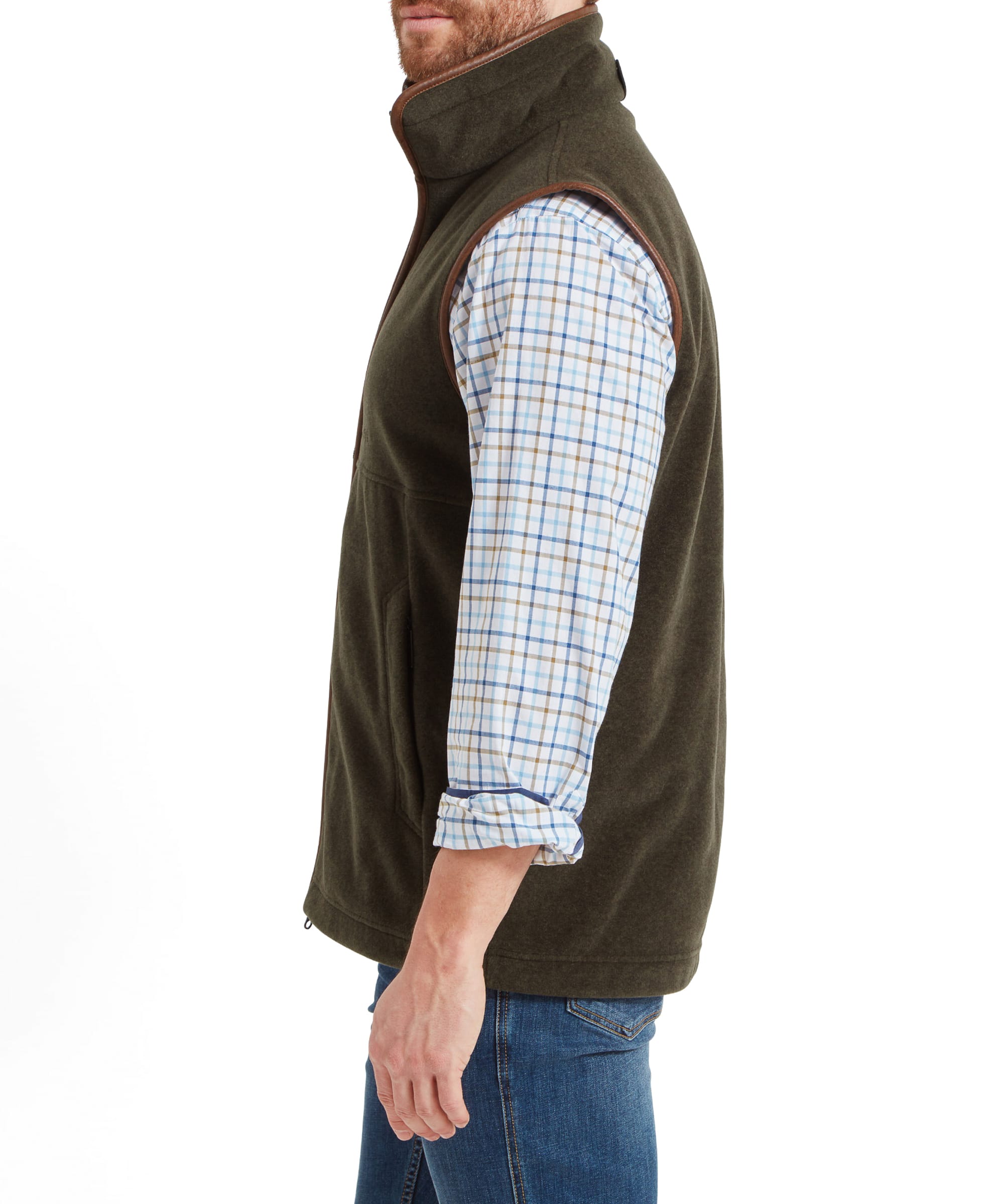 Side profile of a man dressed in the Schöffel Oakham Fleece Gilet for Men in Olive Green, highlighting the gilet’s functional and stylish design.