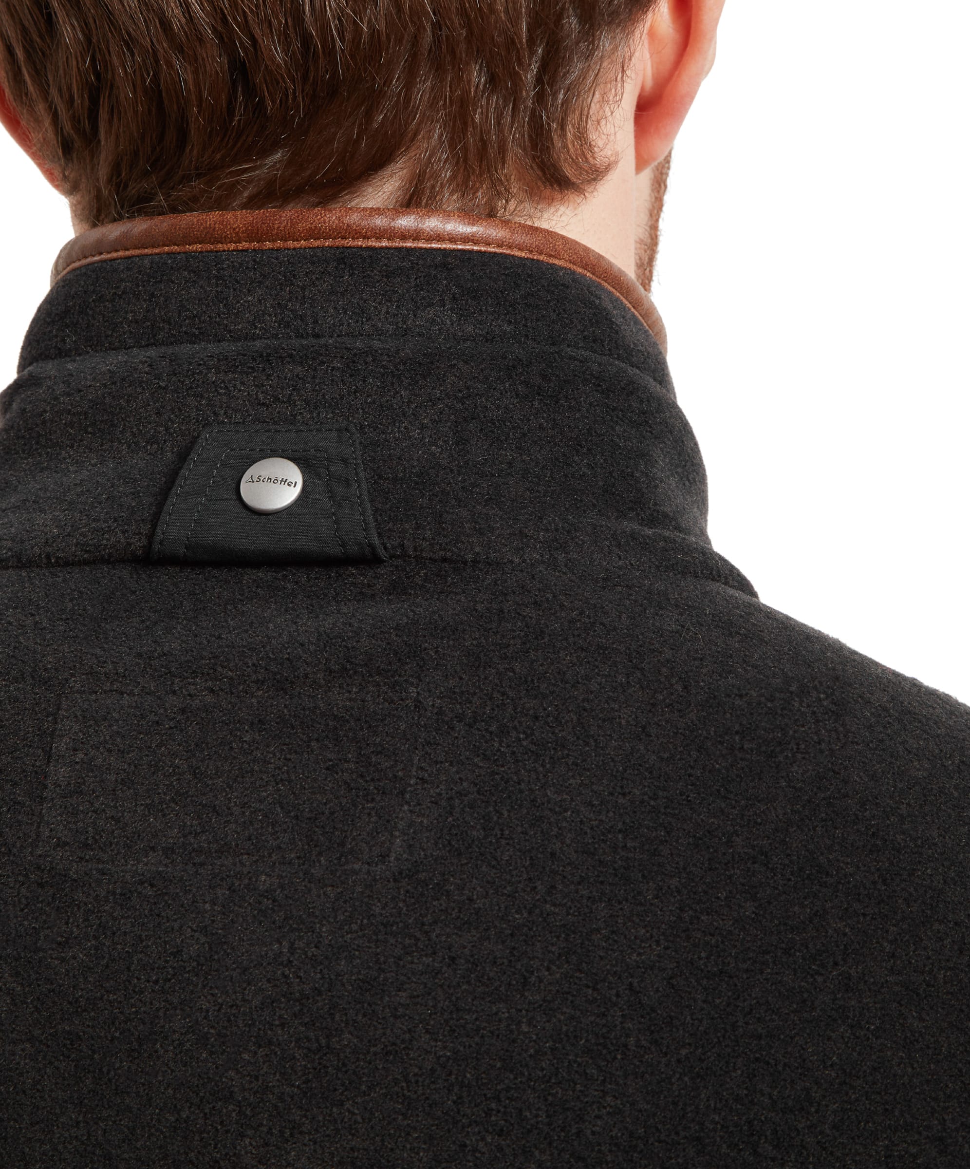 Close-up of the back collar of the Schöffel Oakham Fleece Gilet for Men in Grey, featuring a small button detail.