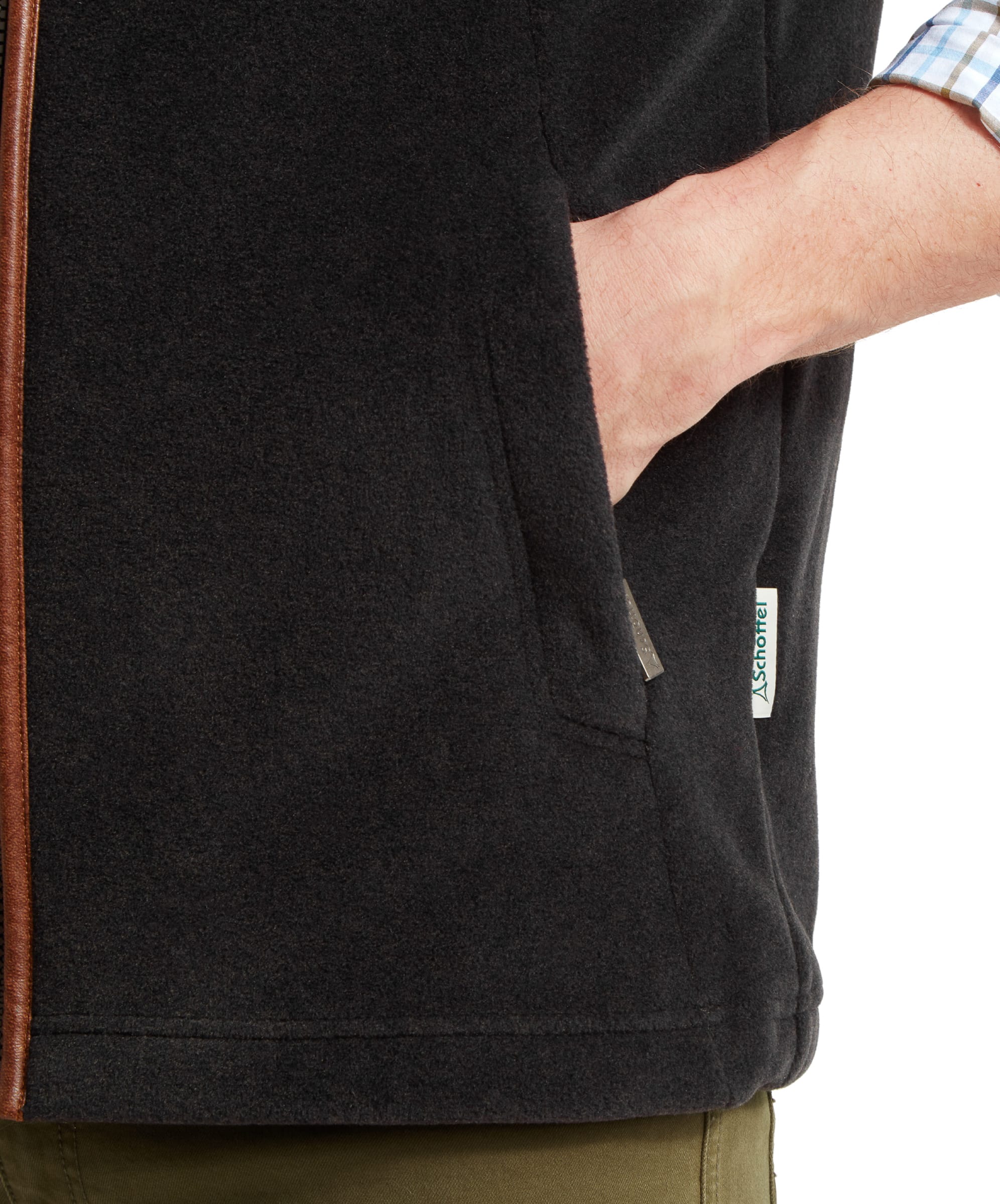 Close-up of the pocket on the Schöffel Oakham Fleece Gilet for Men in Grey, showing the logo and material detail.