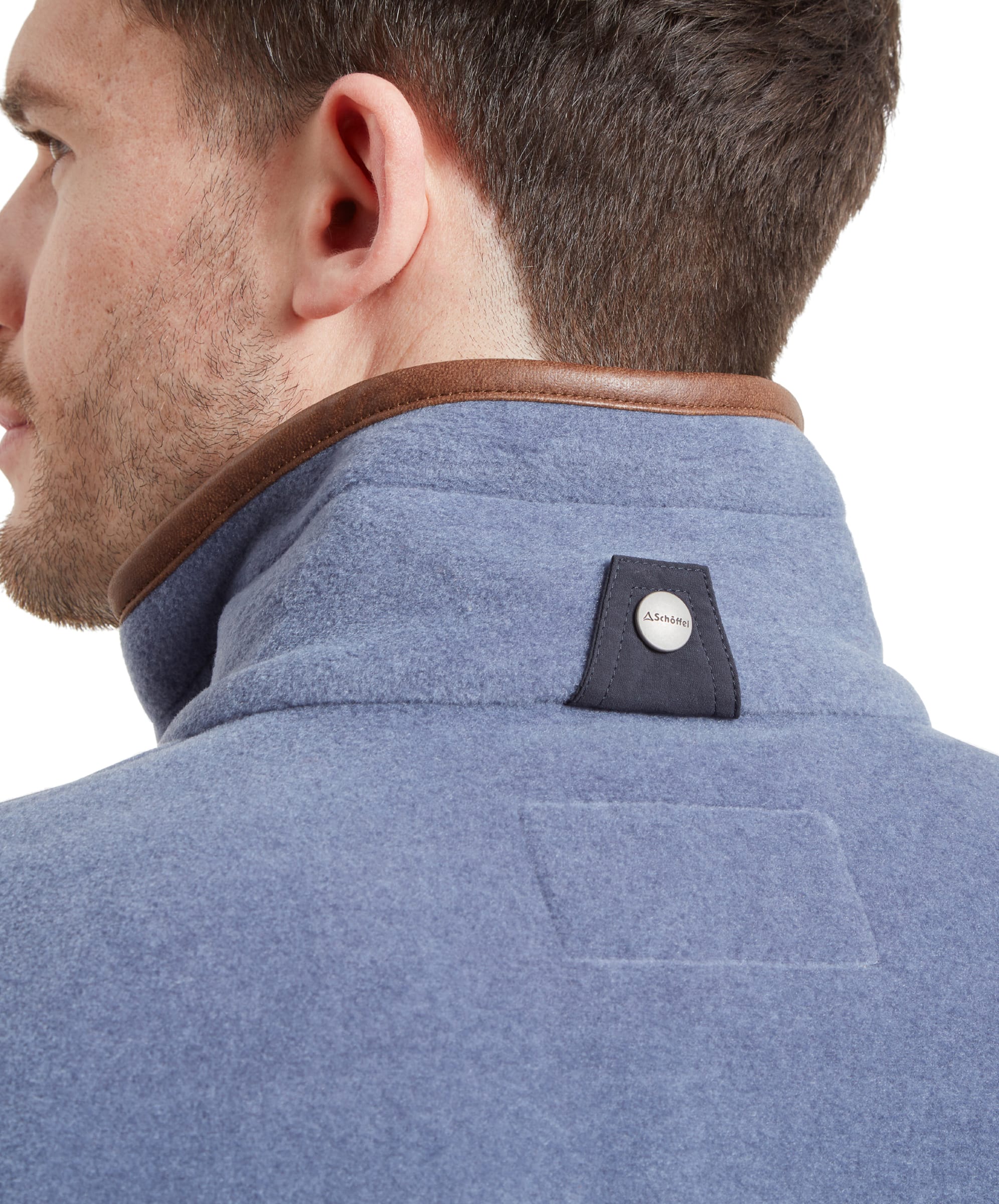 Close-up on the back of the neck on the Schöffel Oakham Fleece Gilet for Men in Light Blue highlighting the button tab