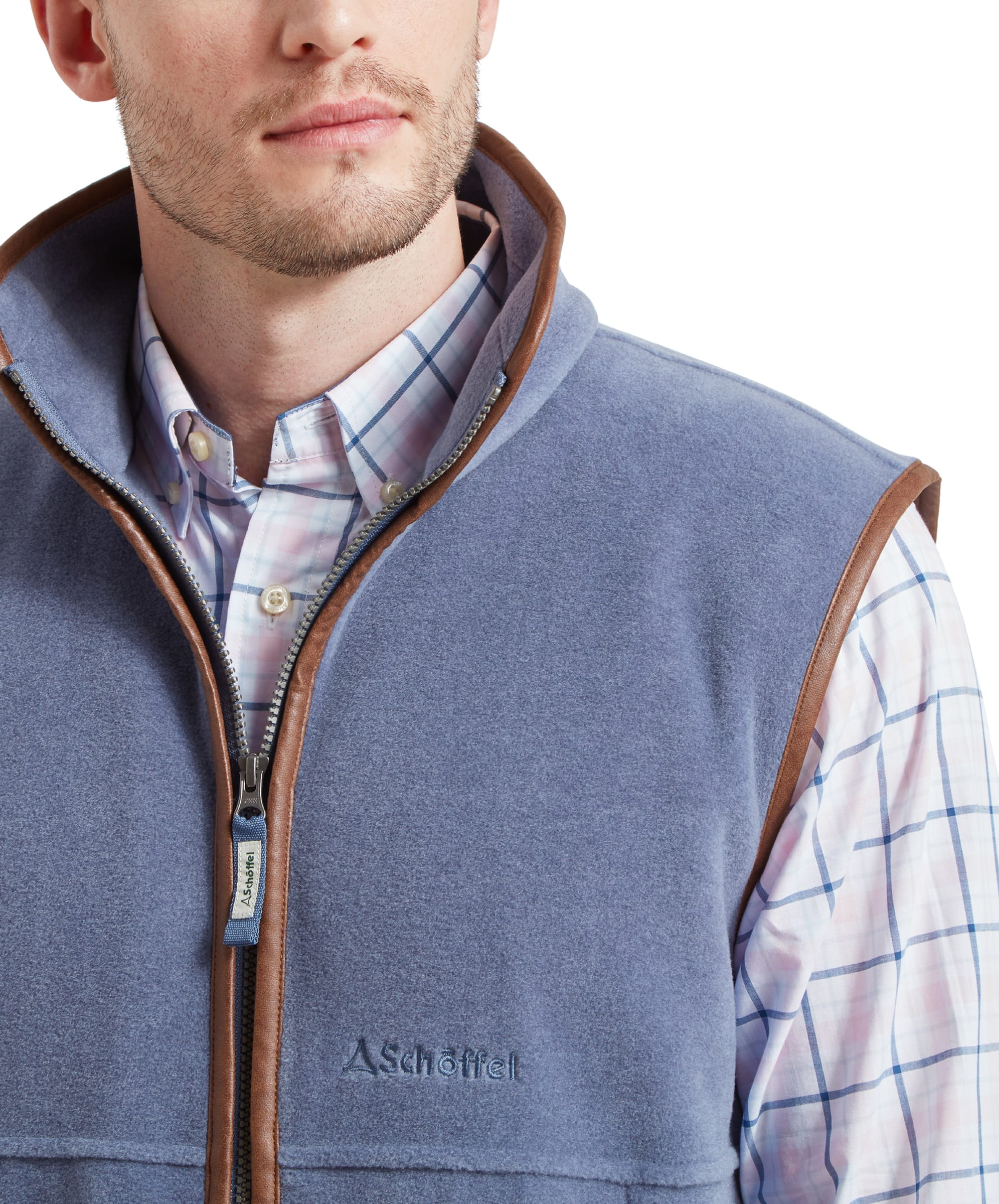 Close-up of the collar area of the Schöffel Oakham Fleece Gilet for Men in Light Blue highlighting the faux leather trim, the branded zip pull and then embroidered Schöffel logo on the chest.