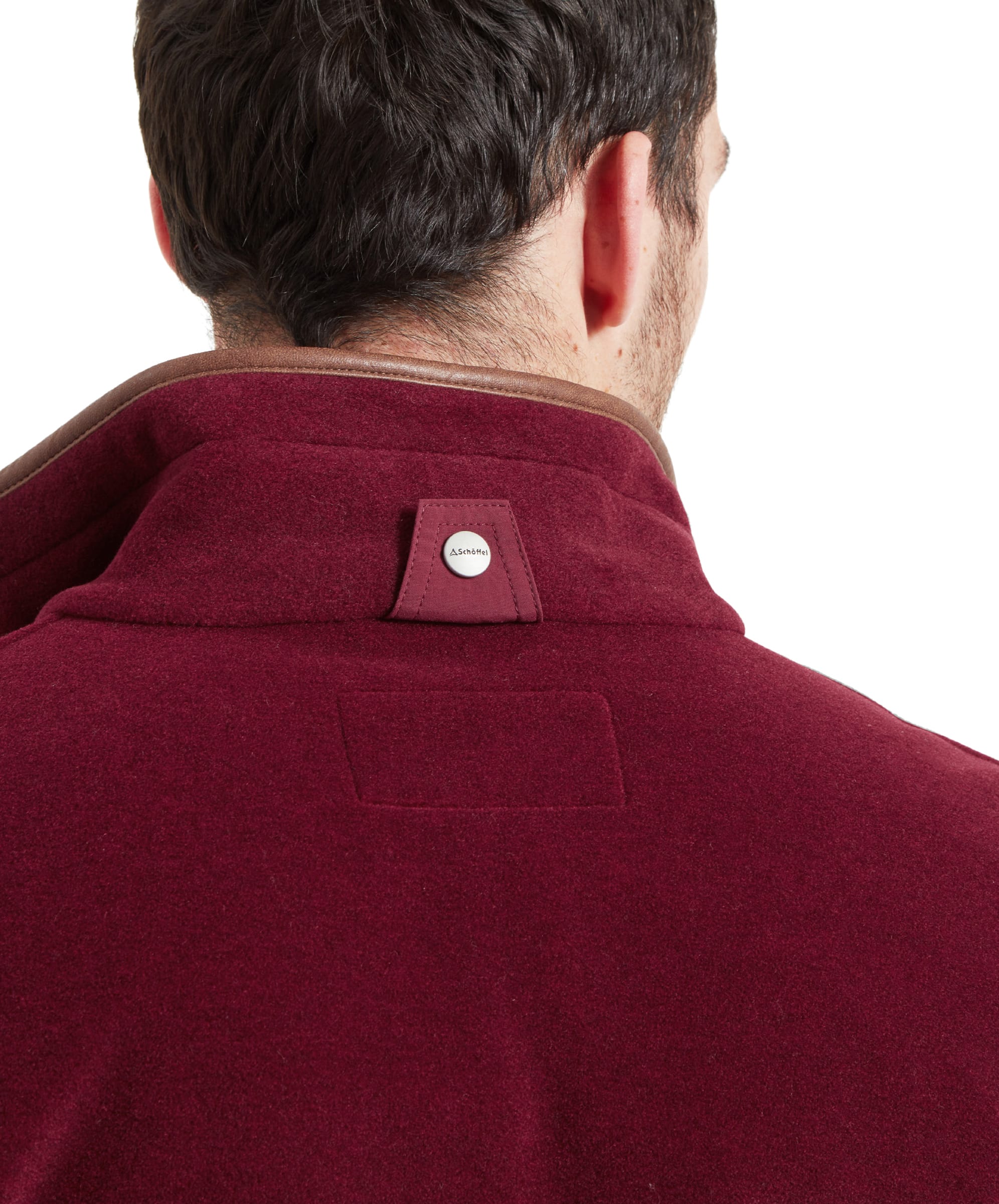 Close-up view of the back collar of the Schöffel Oakham Fleece Gilet for Men in Red, highlighting the Schöffel logo button detail.