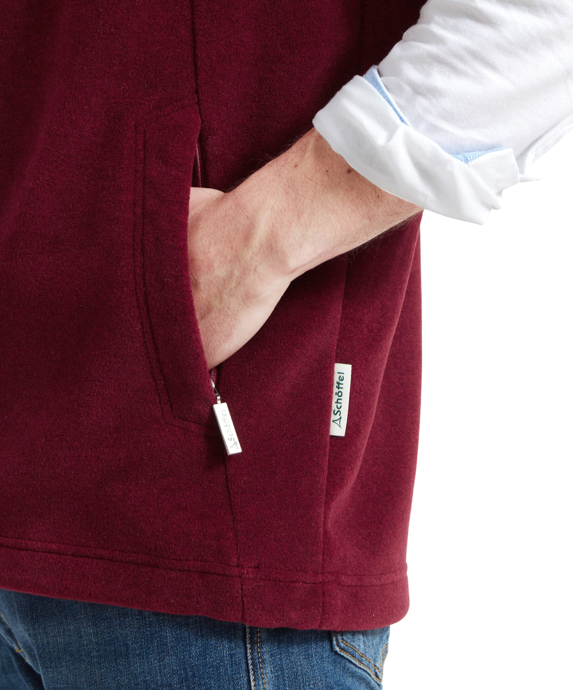 Close-up of the pocket zip and material detail on the Schöffel Oakham Fleece Gilet for Men in Red