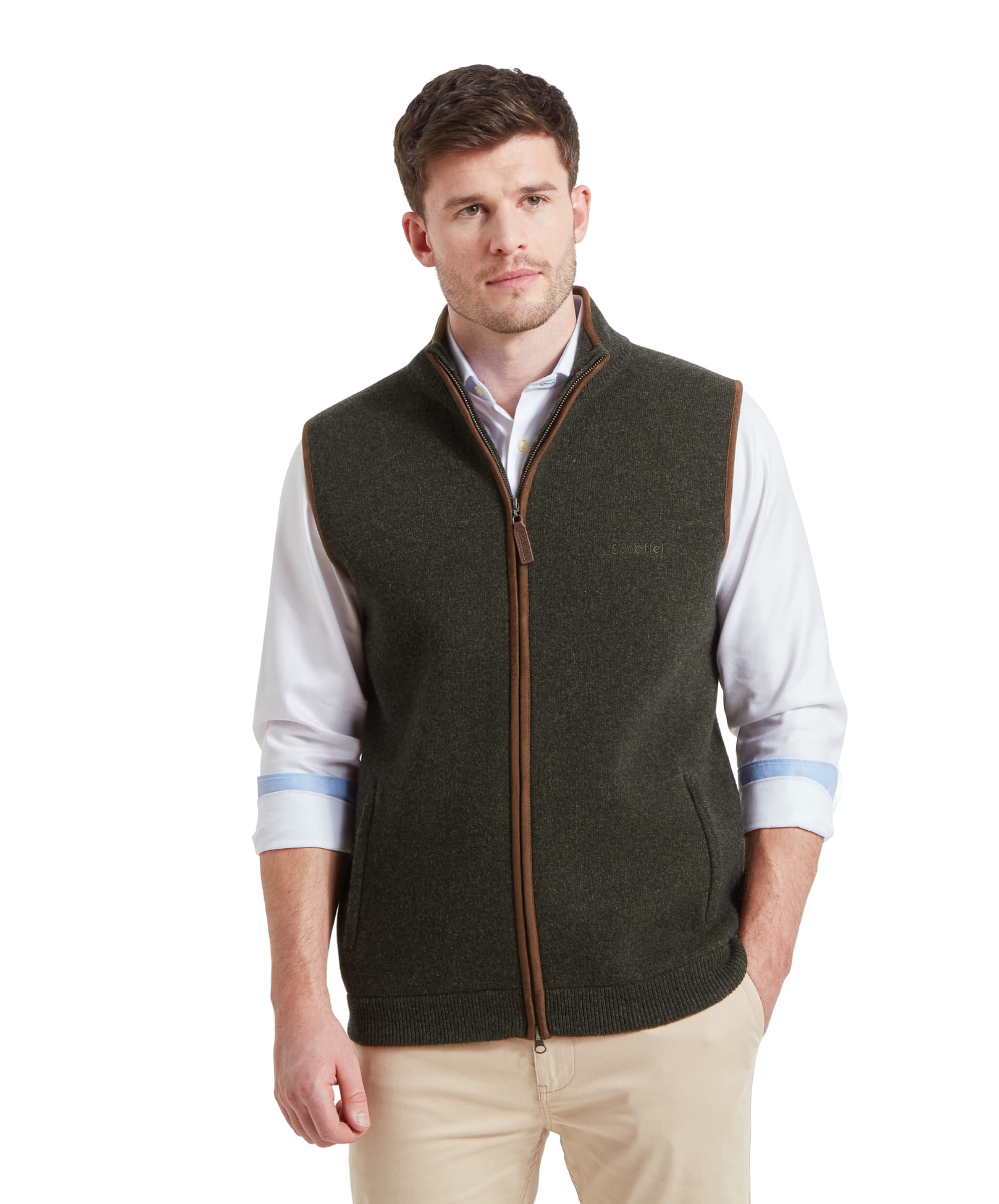 A man wearing the Schöffel Orkney Merino Gilet for Men in Green, standing and looking to the side.