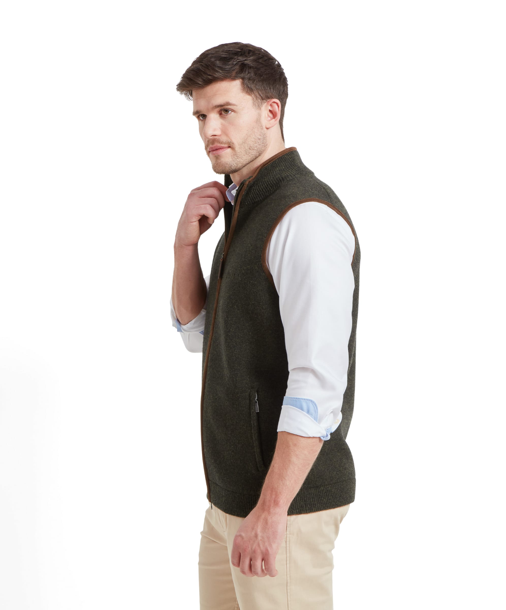 A side view of the man in the Schöffel Orkney Merino Gilet for Men in Green, highlighting the fit and cut of the gilet.