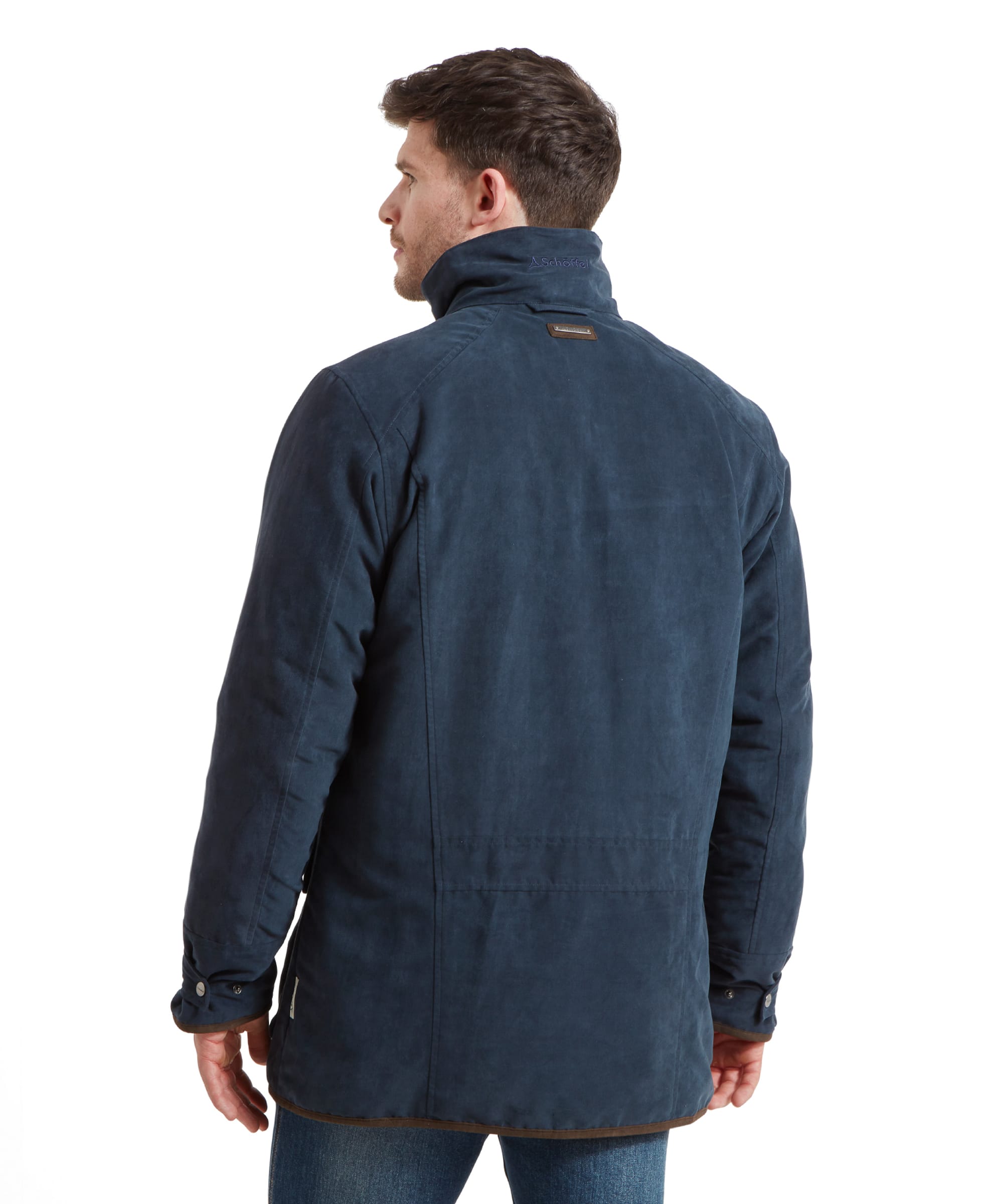 Back view of the man in the coat, showcasing the coat's back design and collar detailing.