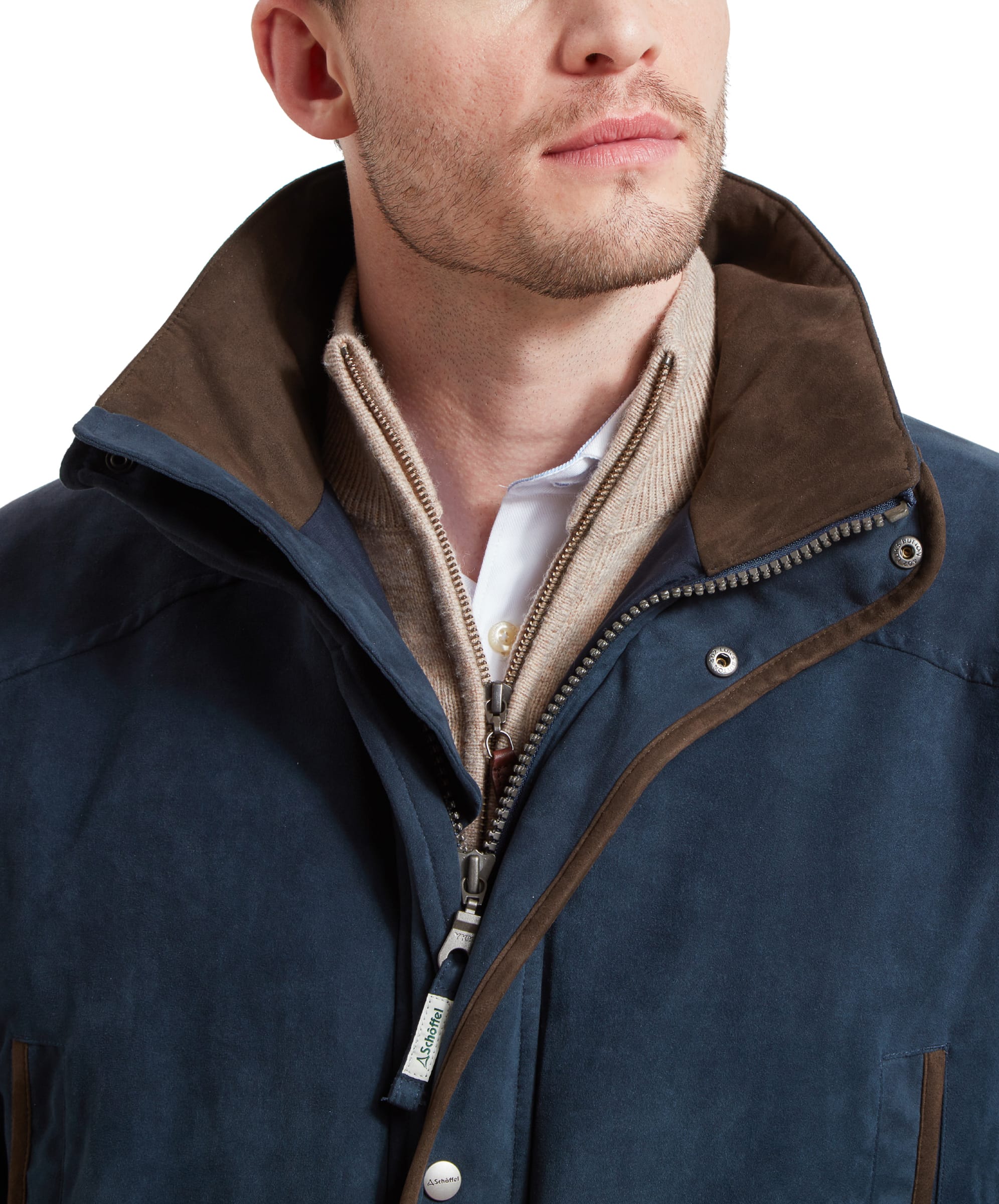 Detailed view of the coat's collar area, highlighting the zip and button closures and the inner lining.