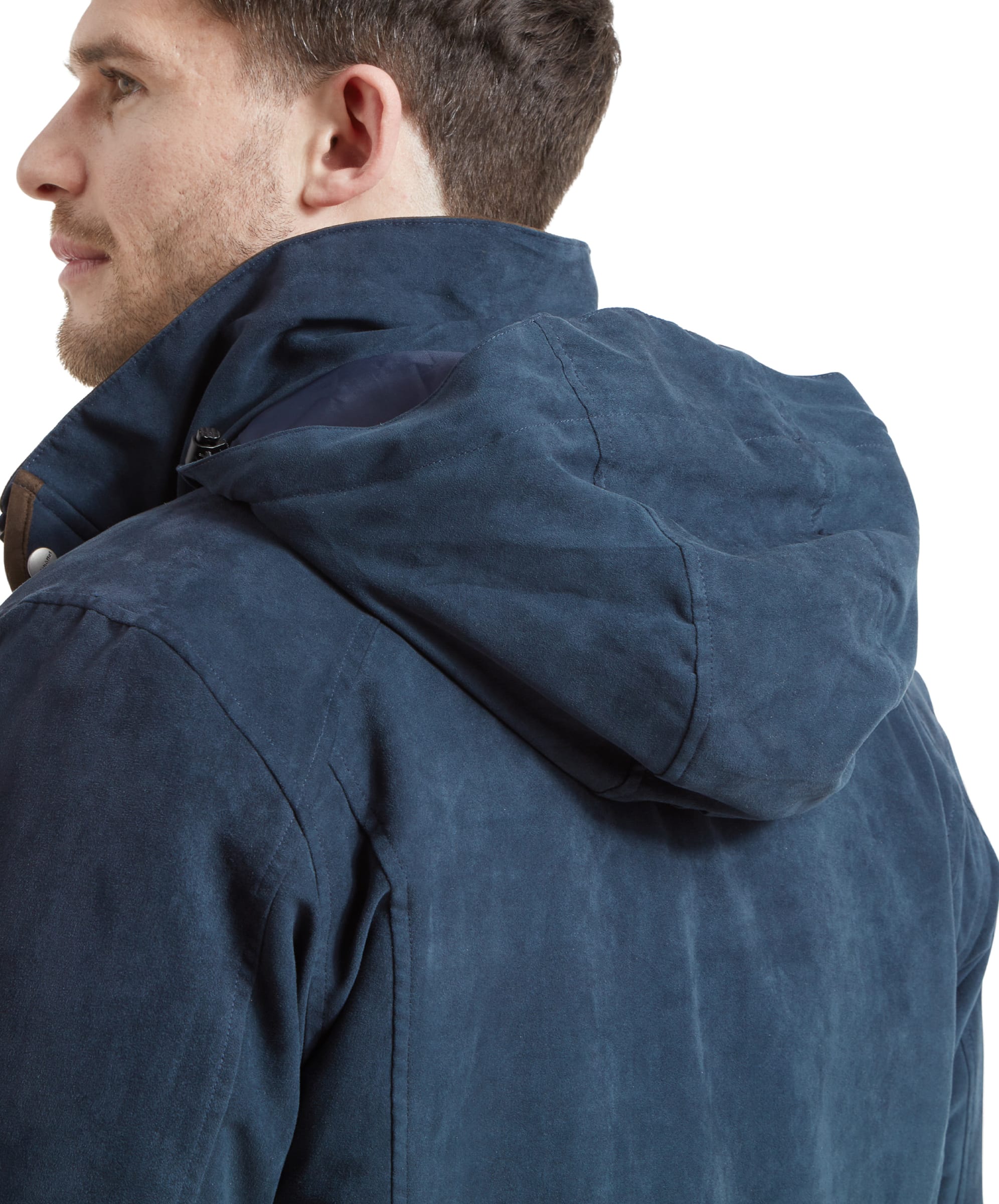 Side view of the model with the coat's detachable hood up, highlighting the coat's versatility and weather-ready features.