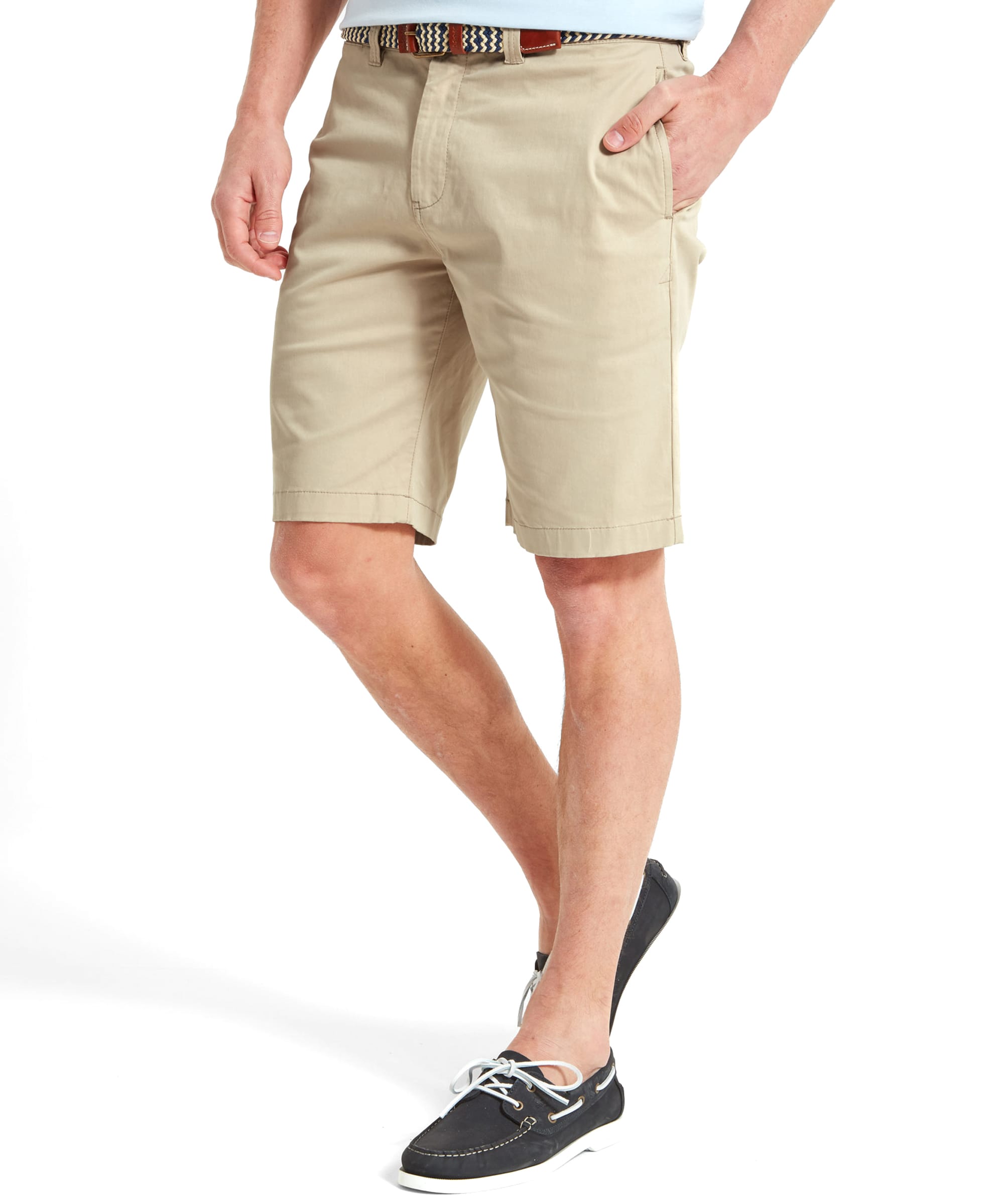 Image of a man wearing Schöffel Paul Shorts for Men in Beige, shown from the front, with his hands in his pockets.