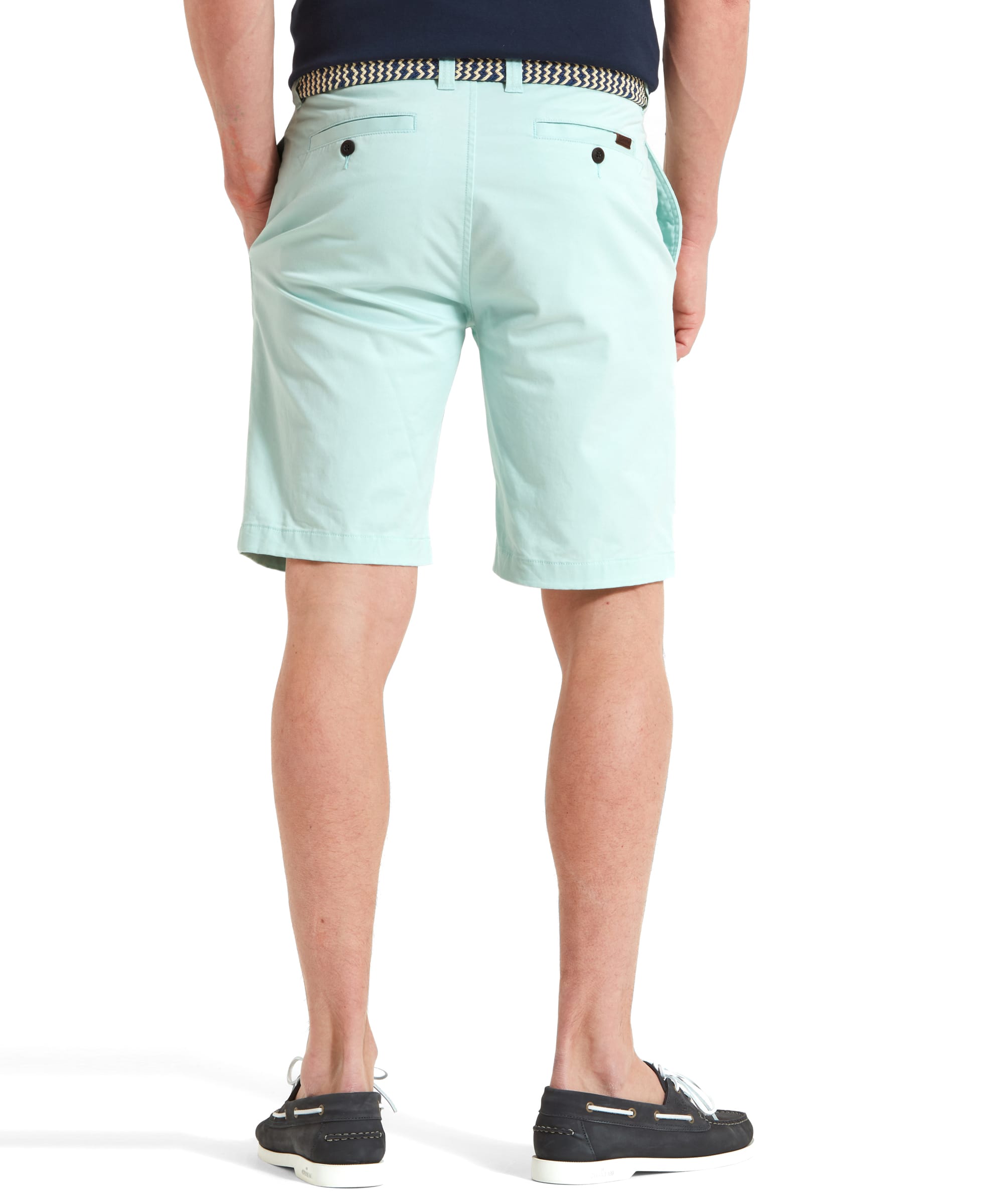 Rear view of Schöffel Paul Shorts for Men in Light Green, highlighting the back pockets and tailored fit.