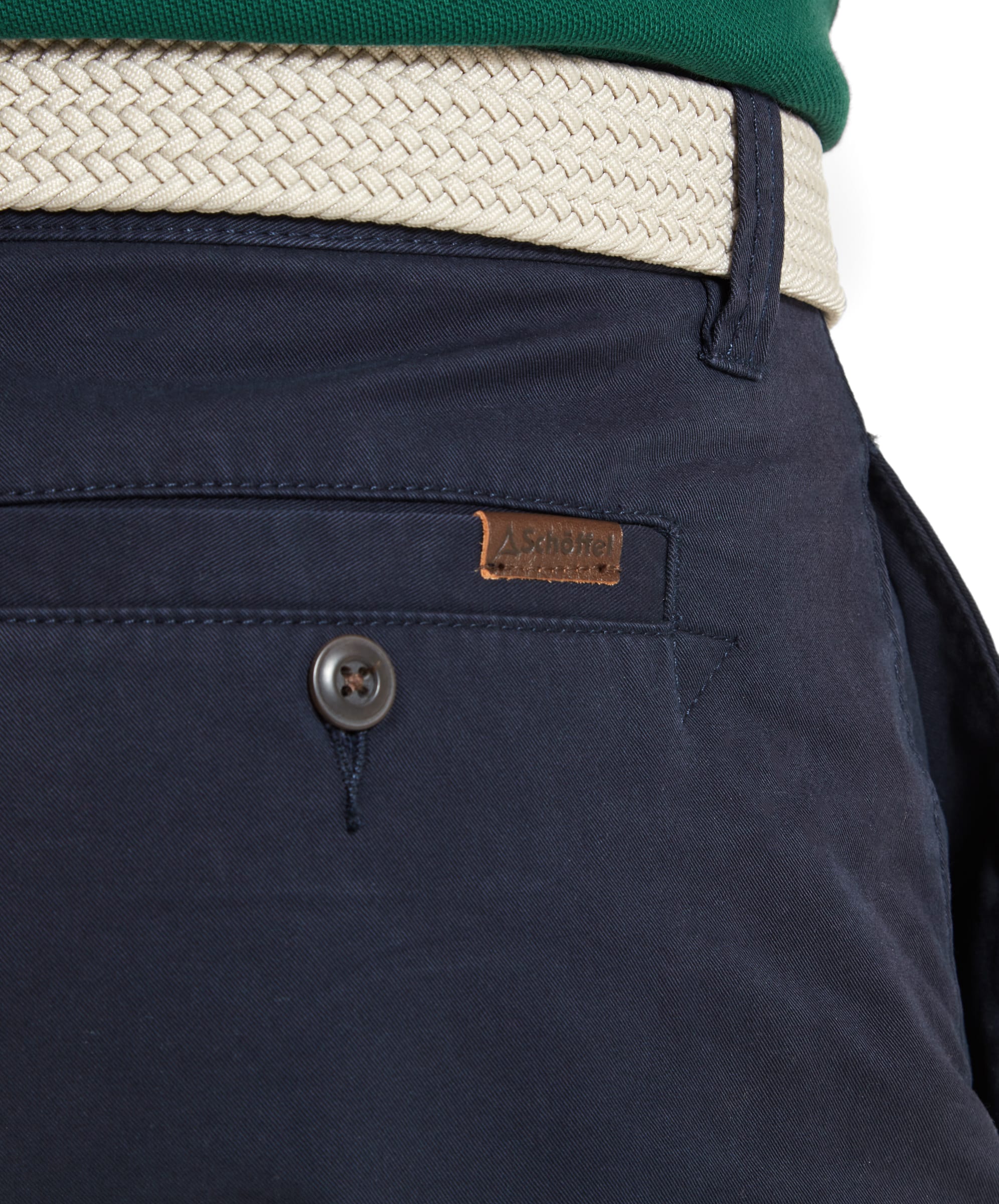 Close-up of the Schöffel Paul Shorts for Men in Navy, highlighting the back pocket with a button and the Schöffel logo patch.