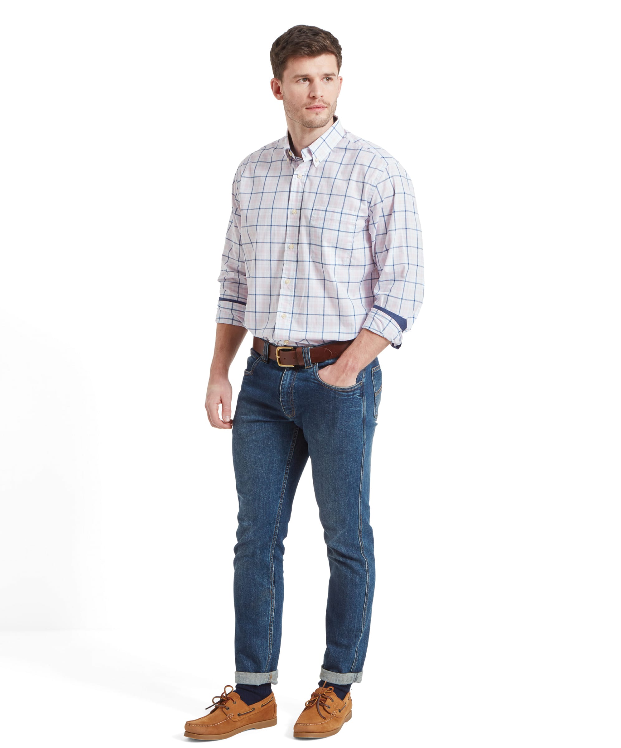 A full-body view of a man wearing Schöffel Polstead Classic Shirt for Men in Blue, paired with jeans and brown shoes.