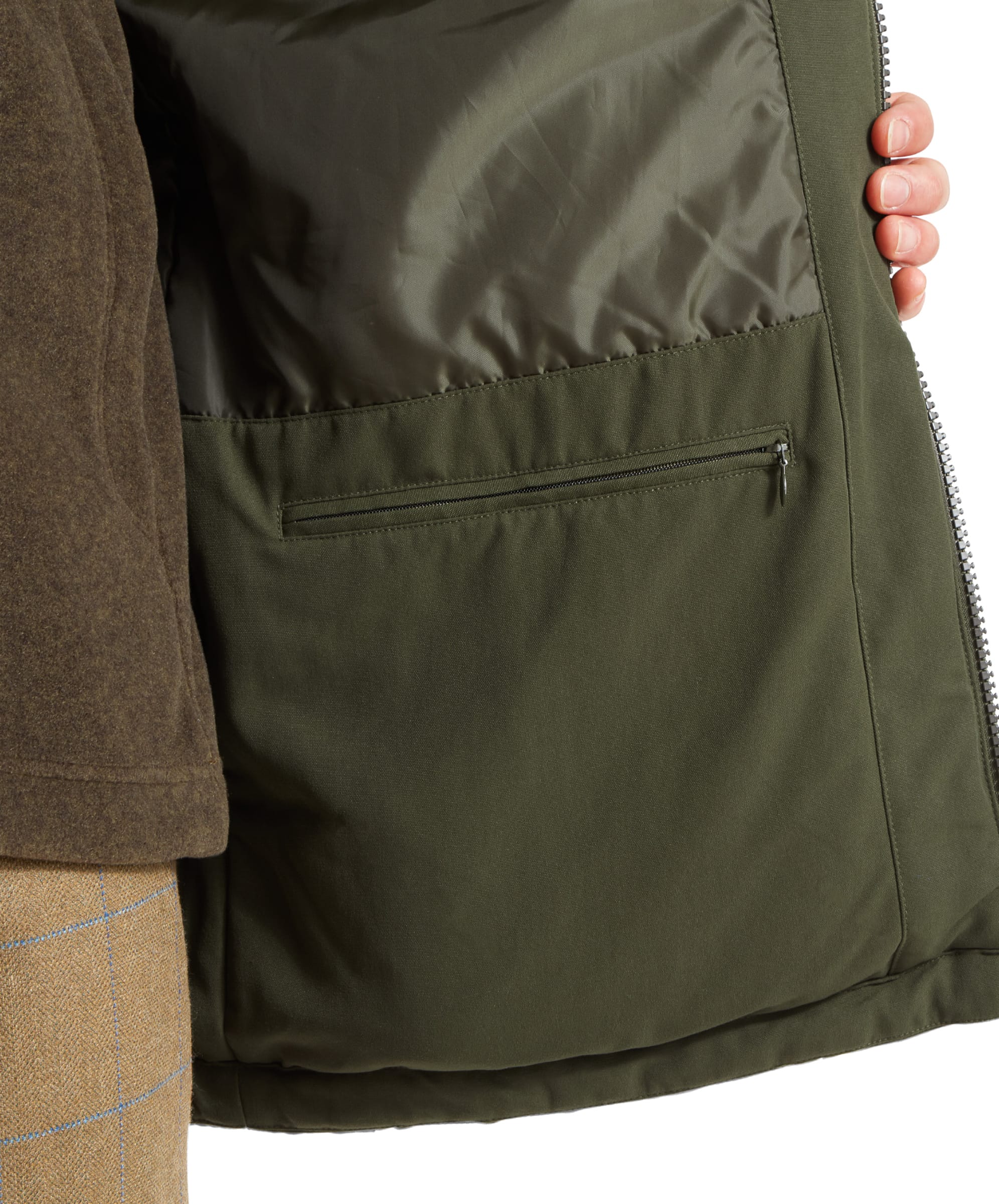 Interior view of the Schöffel Ptarmigan Classic Coat for Men in Green, showing the inner pocket and lining, highlighting the coat's functional design.