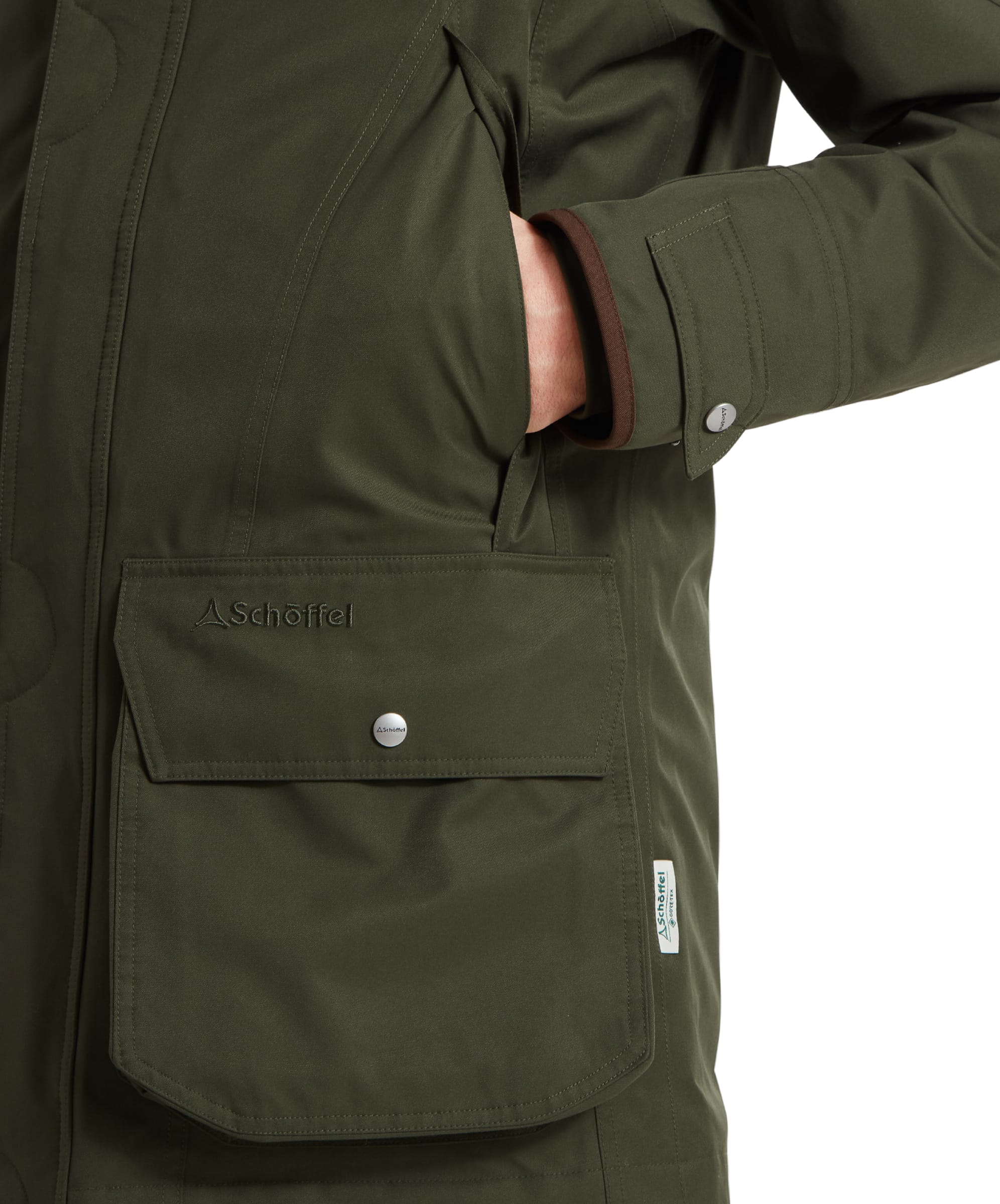 Using the handwarmer pocket of the Schöffel Ptarmigan Extreme II for Men in Green