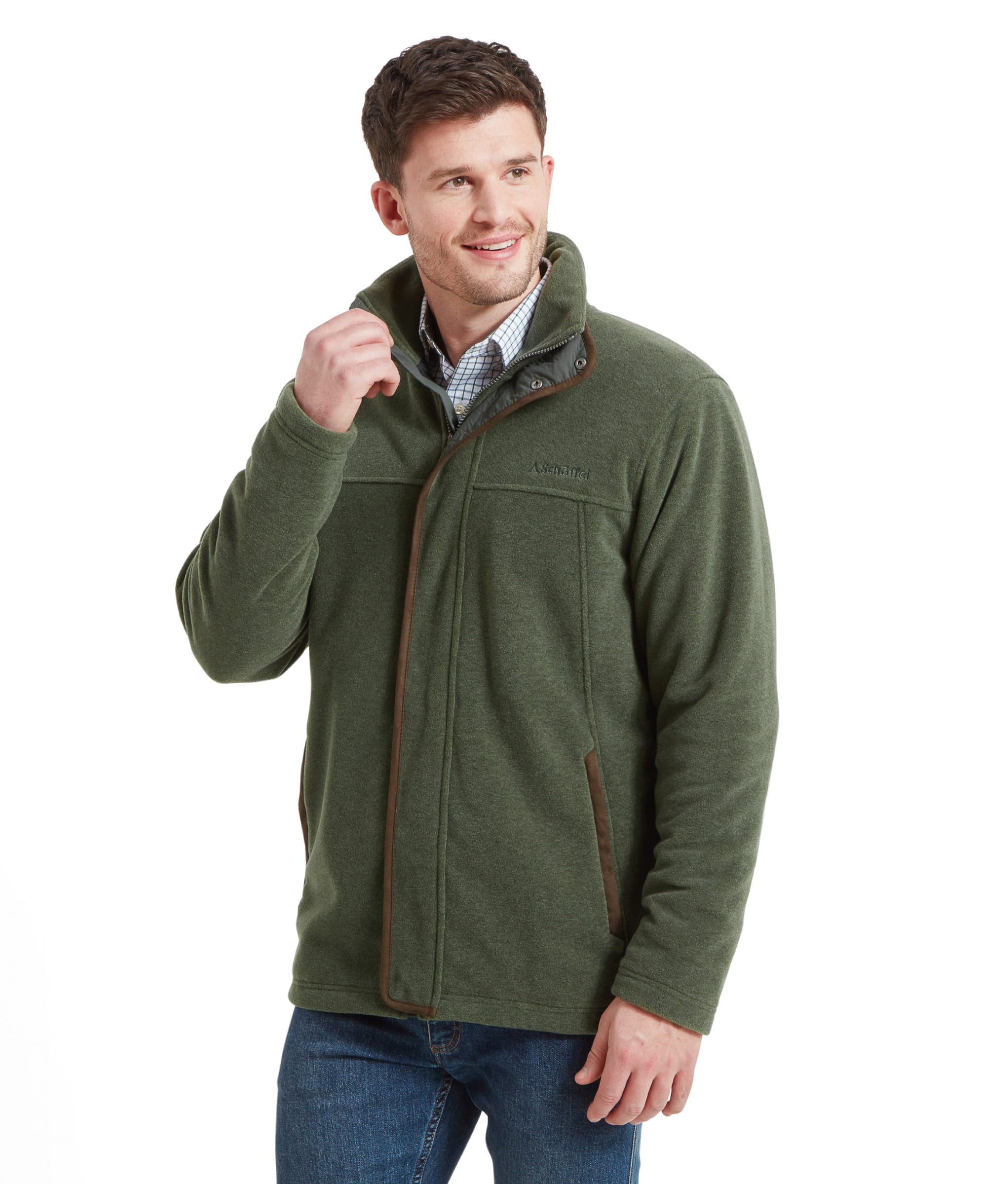 A man adjusts the collar of the Schöffel Rutland Fleece for Men in Green whilst looking to his right side.