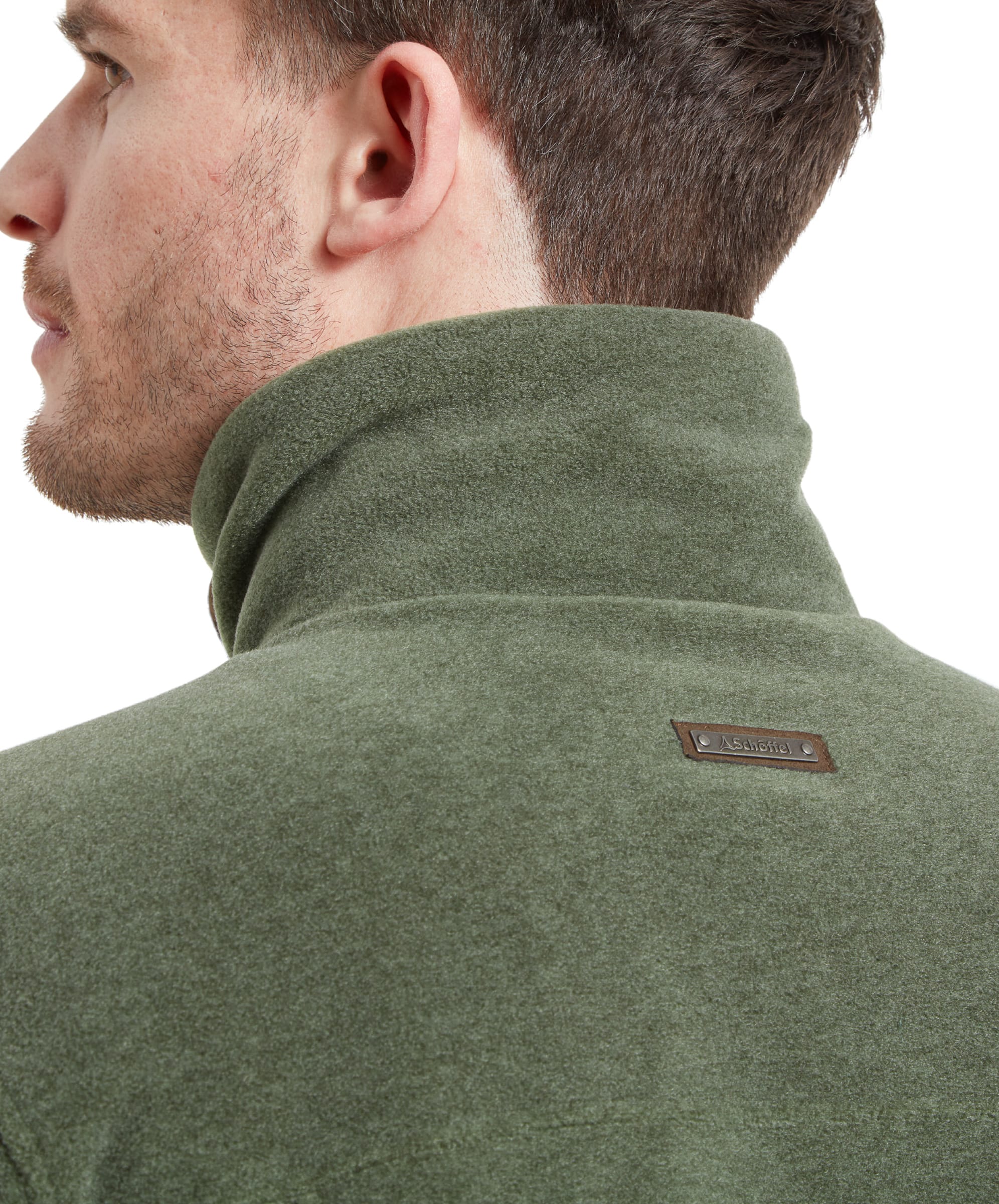 Close-up of the back on the Schöffel Rutland Fleece for Men in Green collar area highlighting the small metal branded tab.