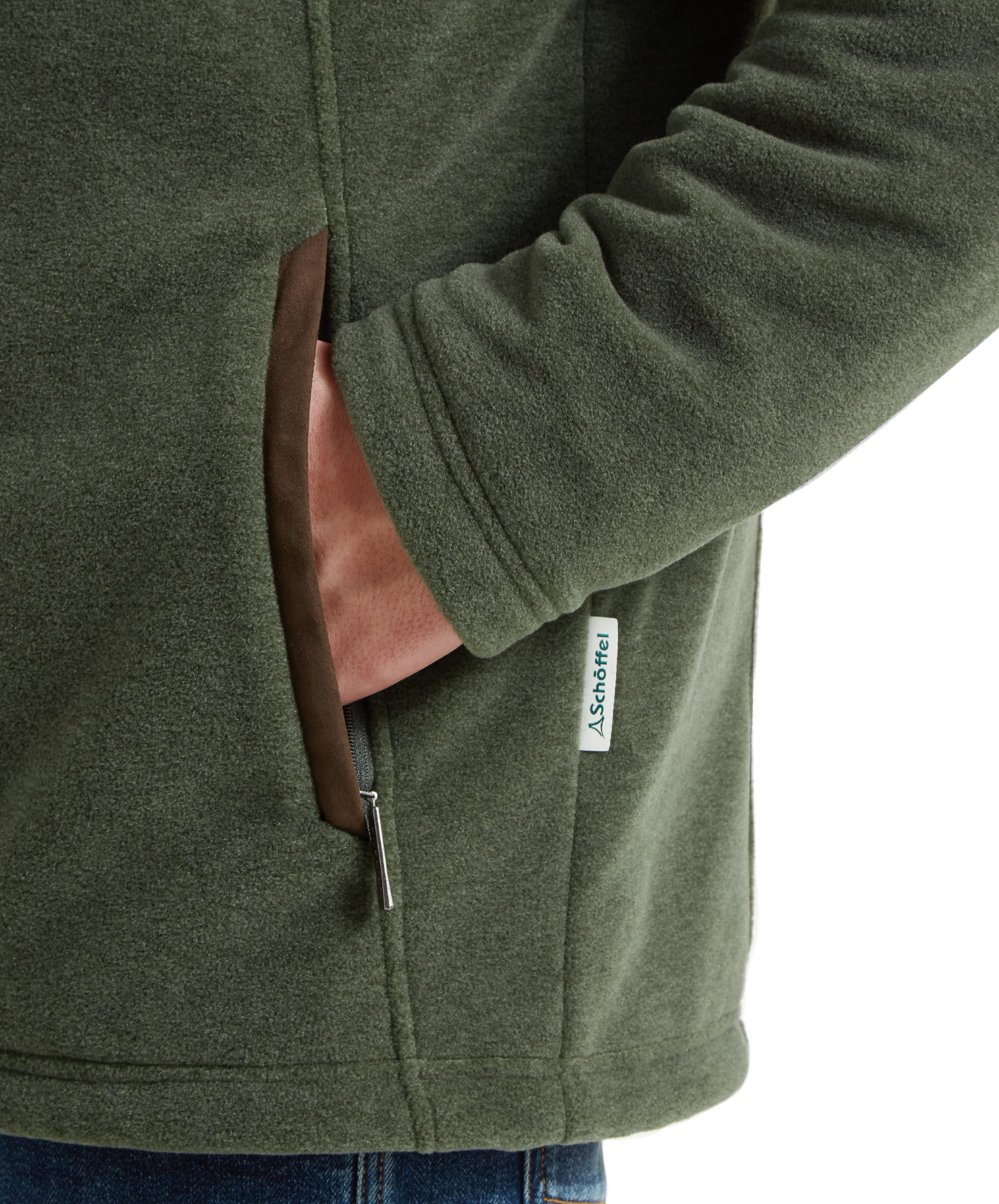 Close-up of the side pocket on the Schöffel Rutland Fleece for Men in Green highlighting the suede finish edge and the logo side seam tag.