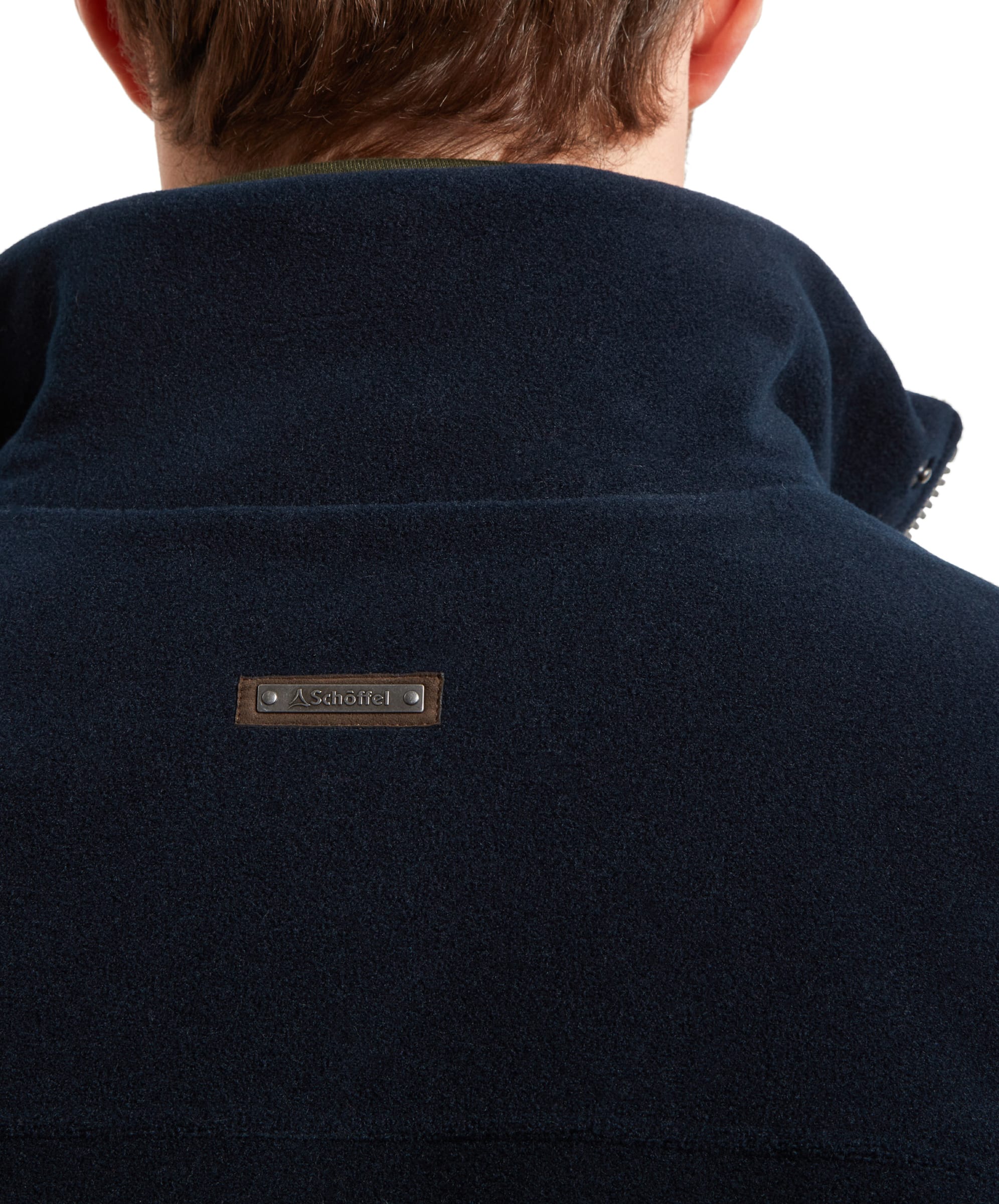 Close-up on the back of the Schöffel Rutland Fleece for Men in Navy neck highlighting the small mental brand tag.