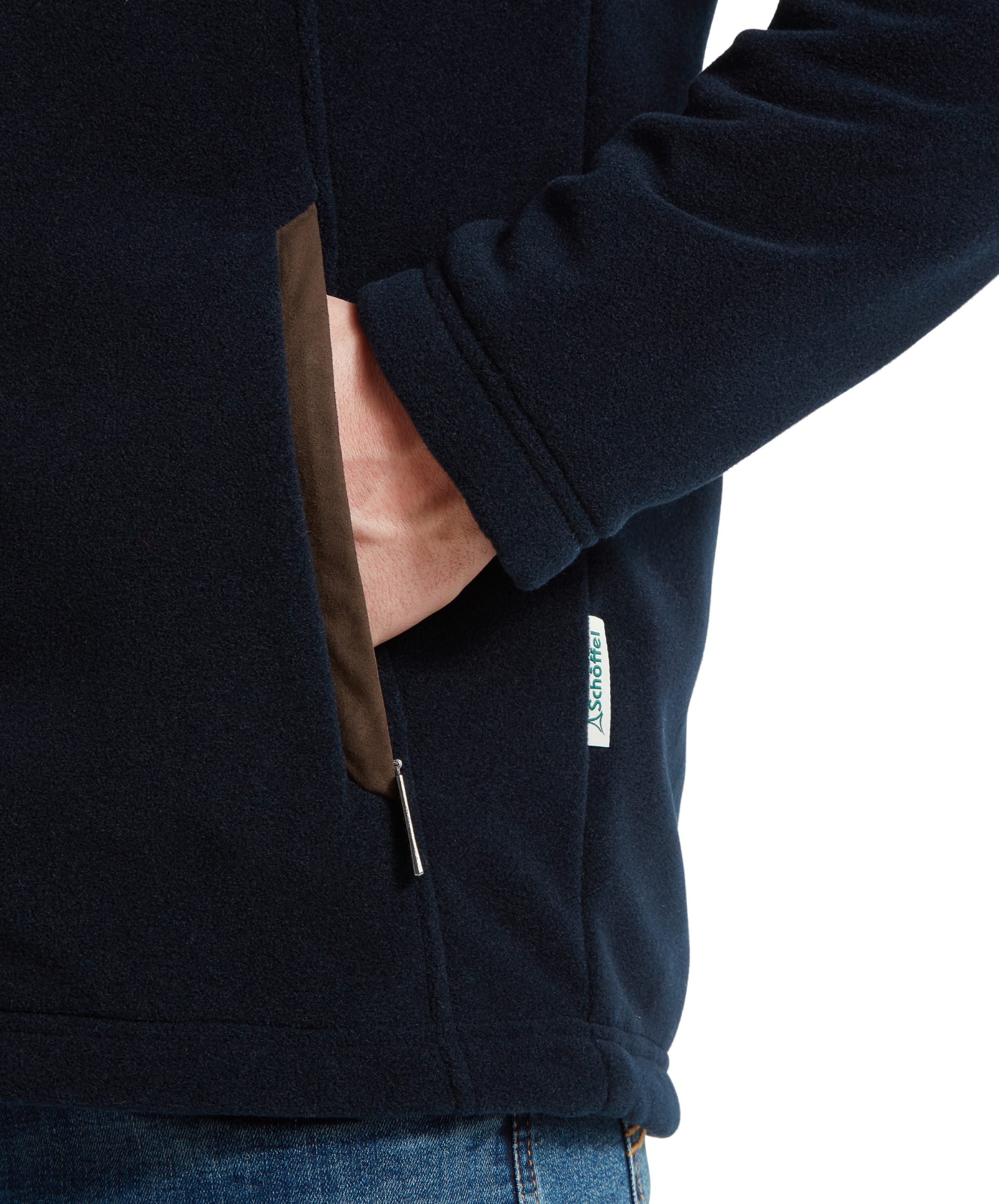 Close-up of the front pockets on the Schöffel Rutland Fleece for Men in Navy highlighting the brown suede trimming and logo brand tag on the seam.