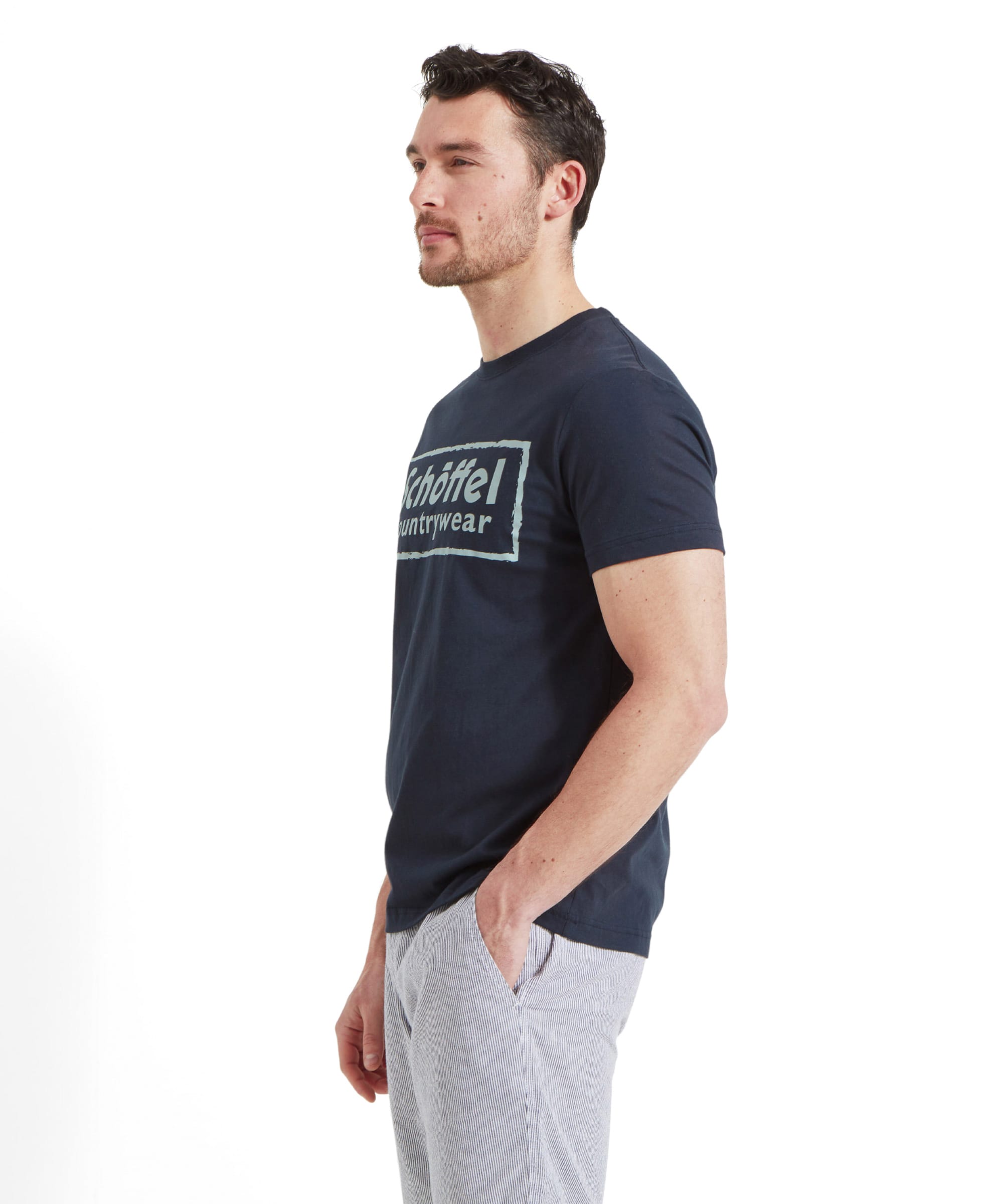 Side view profile of a man modelling the Schöffel Heritage T-Shirt for Men in Navy highlighting the fit and sleeve length.