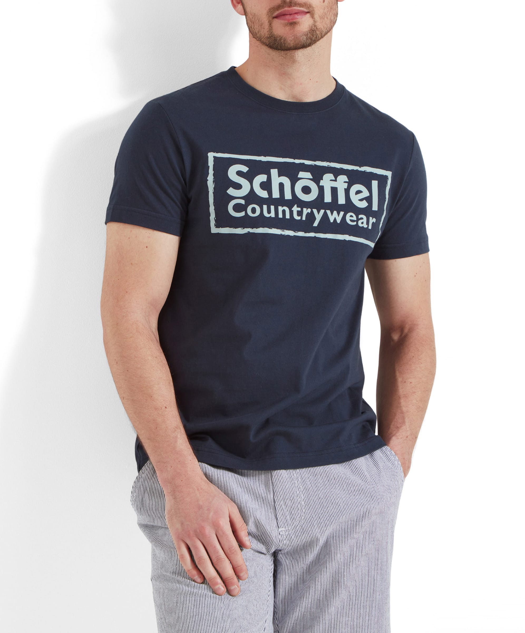 Close-up of the Schöffel Heritage T-Shirt for Men in Navy chest highlighting the logo design on the front.