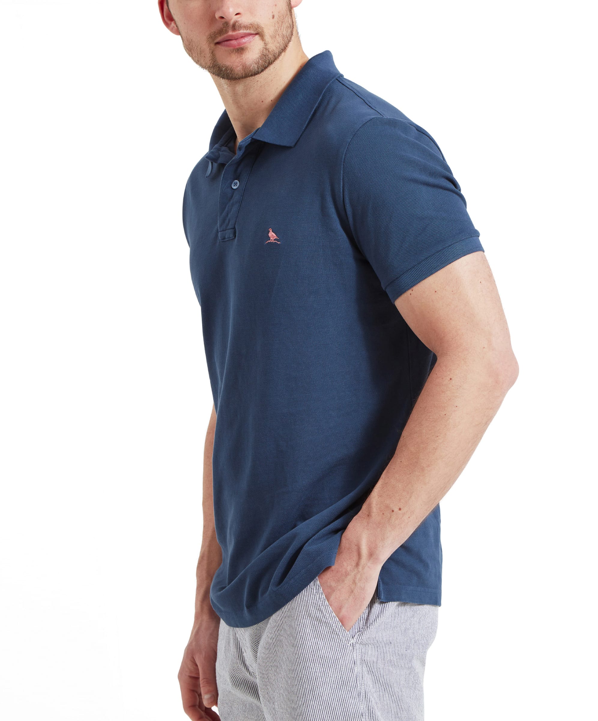 Side view of the Schöffel St Ives Garment Dyed Polo Shirt for Men in Blue highlighting the fit, fabric texture and sleeve length.