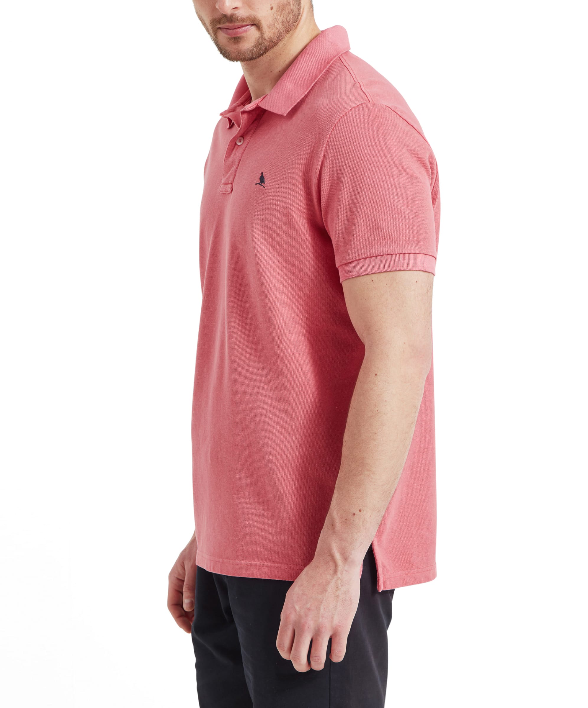 A side view of the Schöffel St Ives Garment Dyed Polo Shirt for Men in Pink highlighting the fit and sleeve length