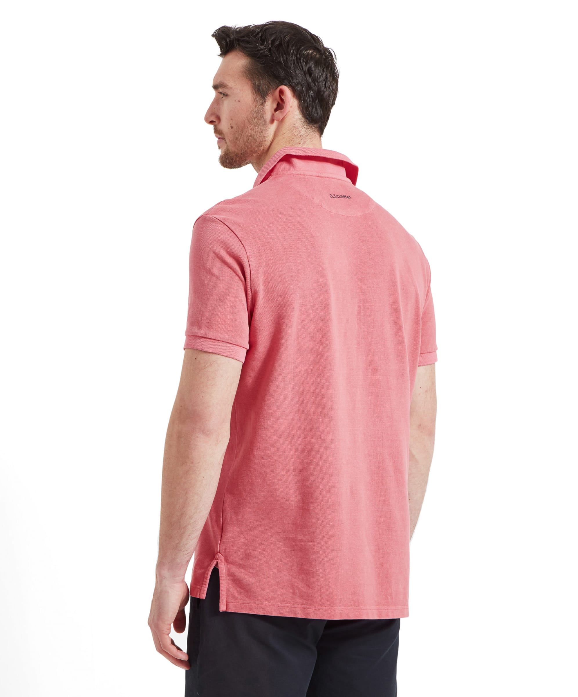 Back view of the Schöffel St Ives Garment Dyed Polo Shirt for Men in Pink highlighting the shirt length and hem detail.