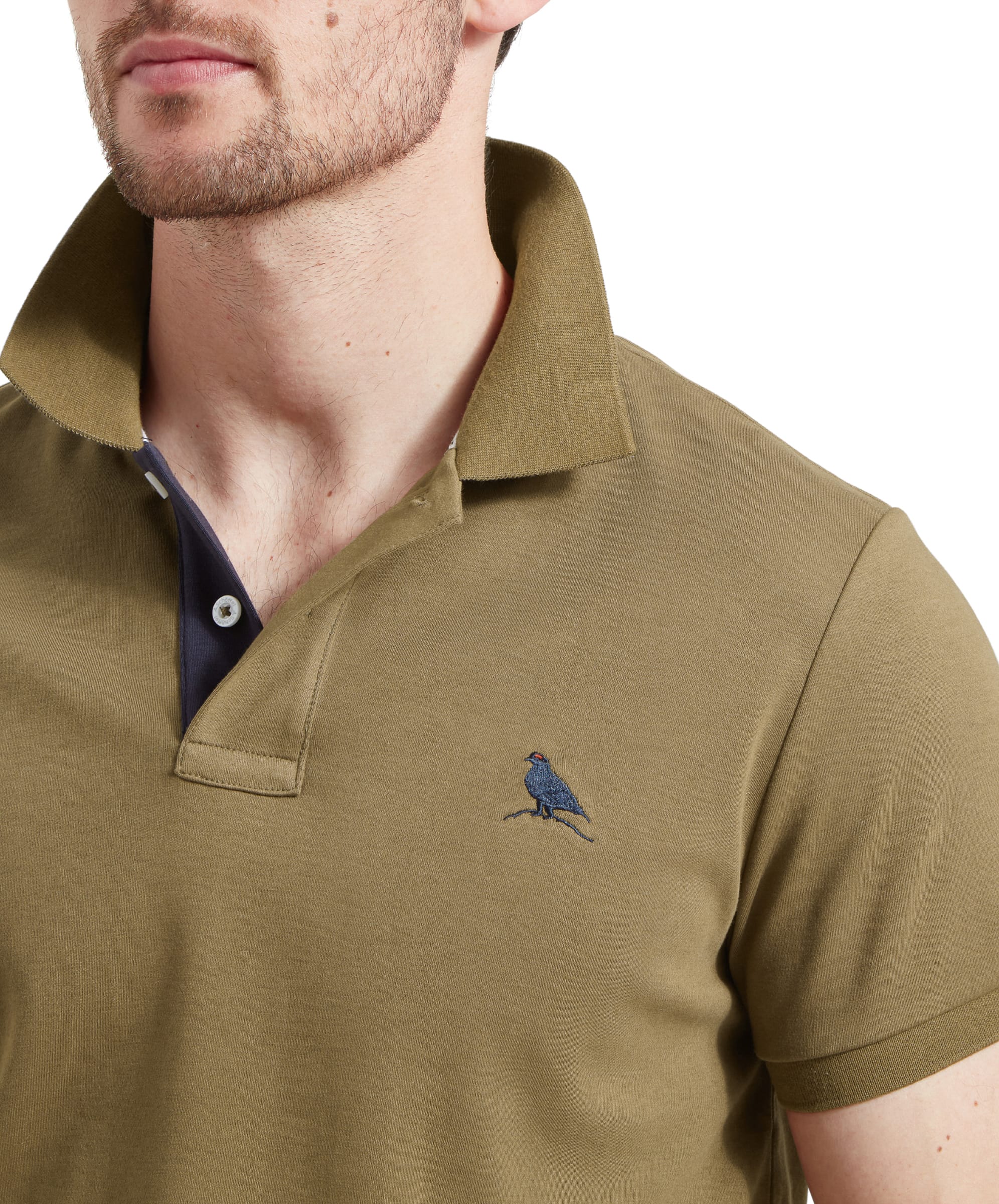 Close-up of the collar area, showcasing the contrasting inner lining and the button details. The embroidered bird logo is clearly visible on the left chest.