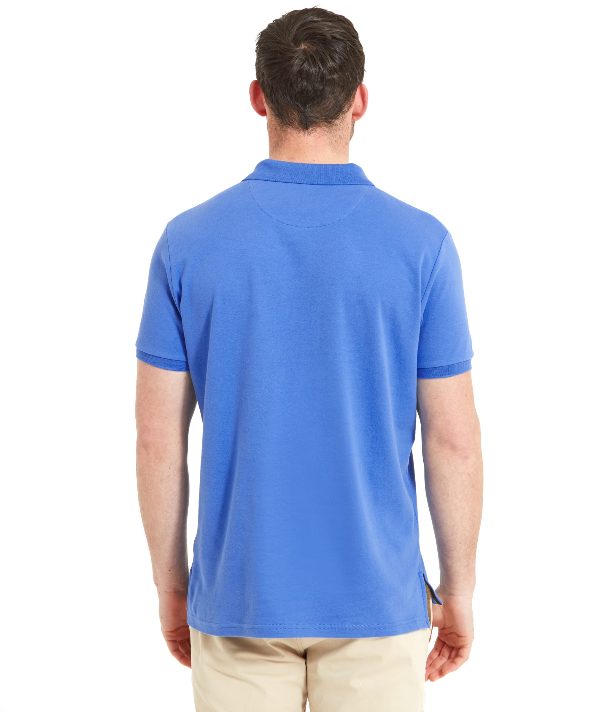 Rear view of the man, highlighting the back of the Schöffel St Ives Jersey Polo Shirt for Men in Light Blue.