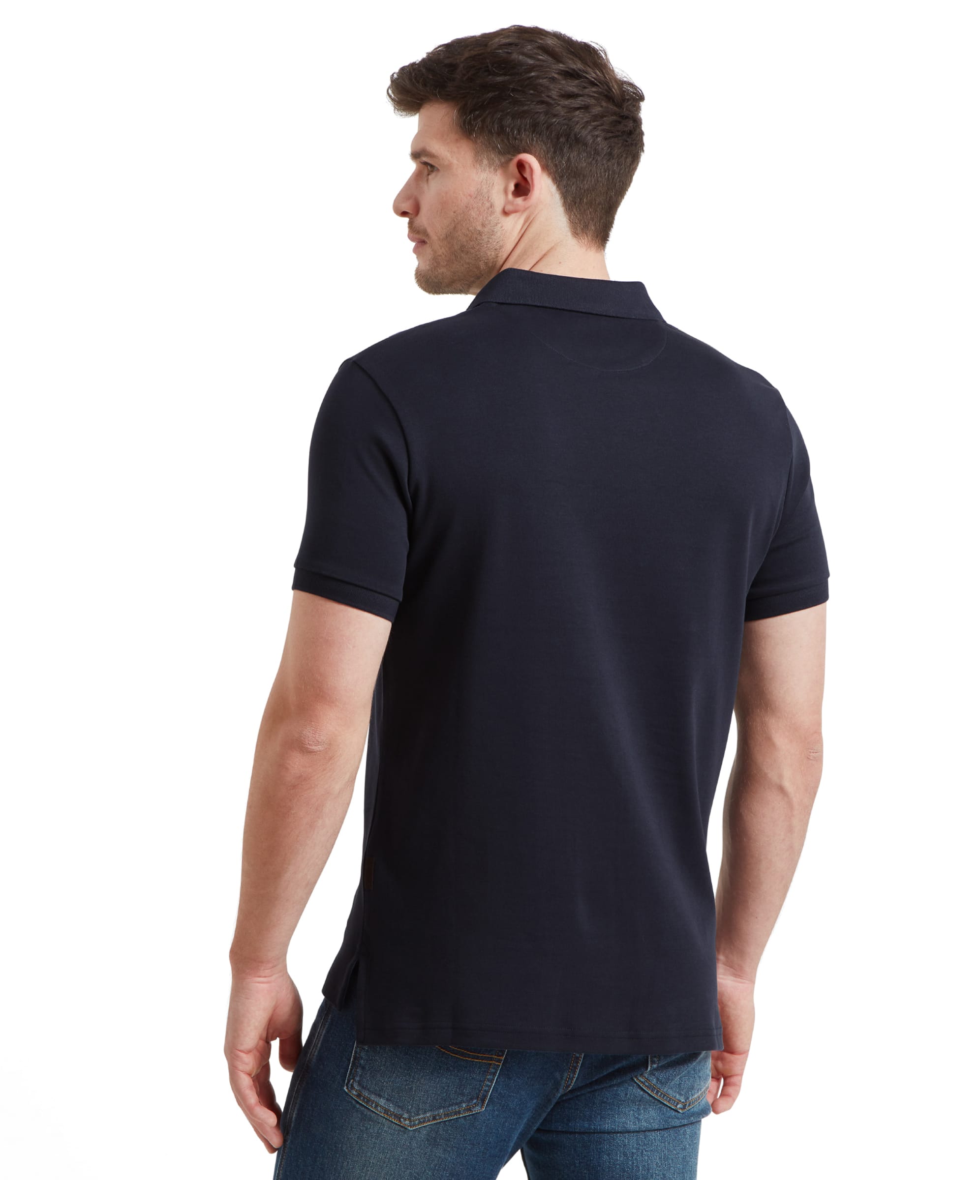 Rear view of the man, highlighting the back of the Schöffel St Ives Jersey Polo Shirt for Men in Navy.