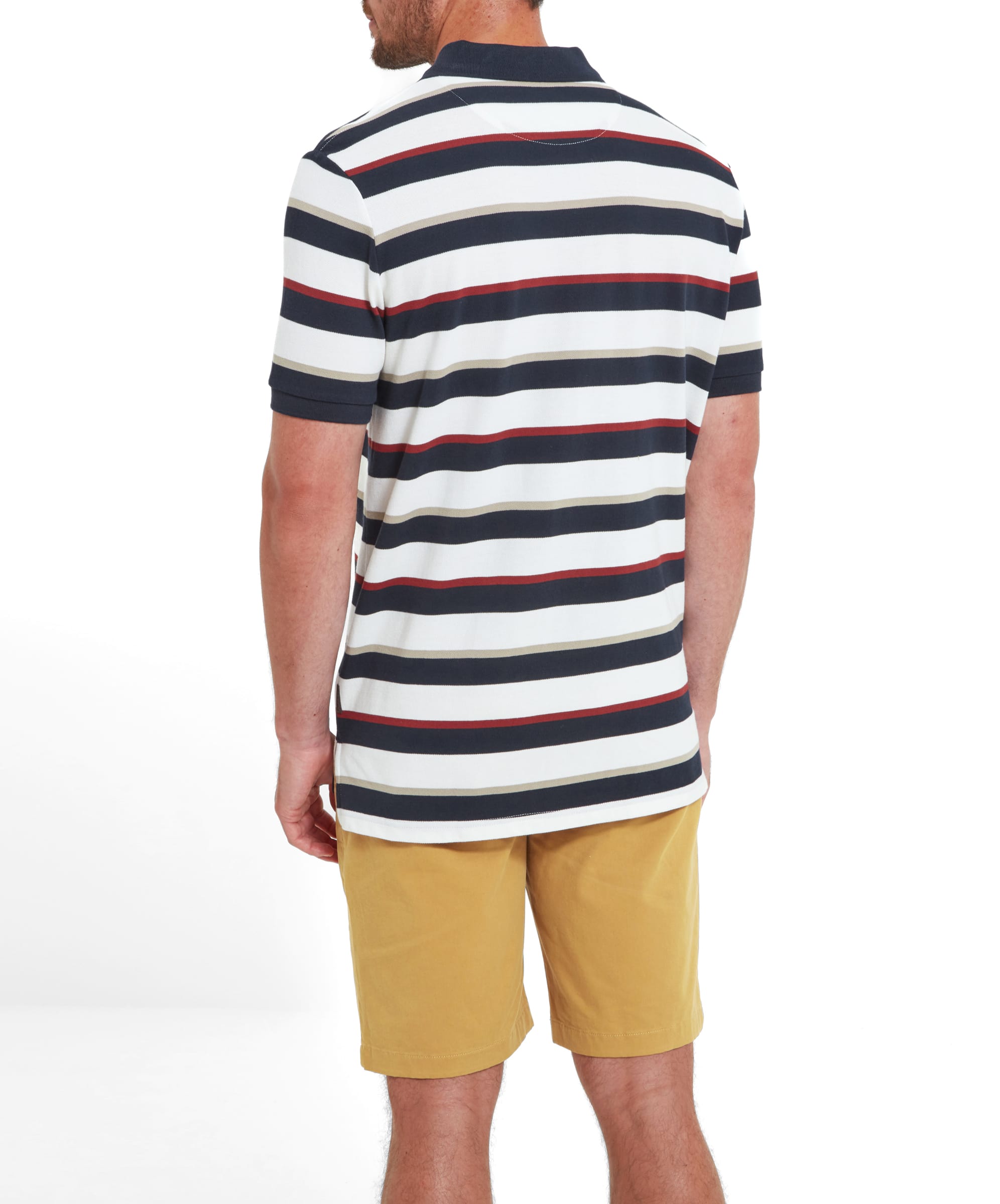 Rear view of the man, highlighting the back of the Schöffel St Ives Polo Shirt for Men in Red and the pattern of the stripes. The shirt is paired with mustard yellow shorts.