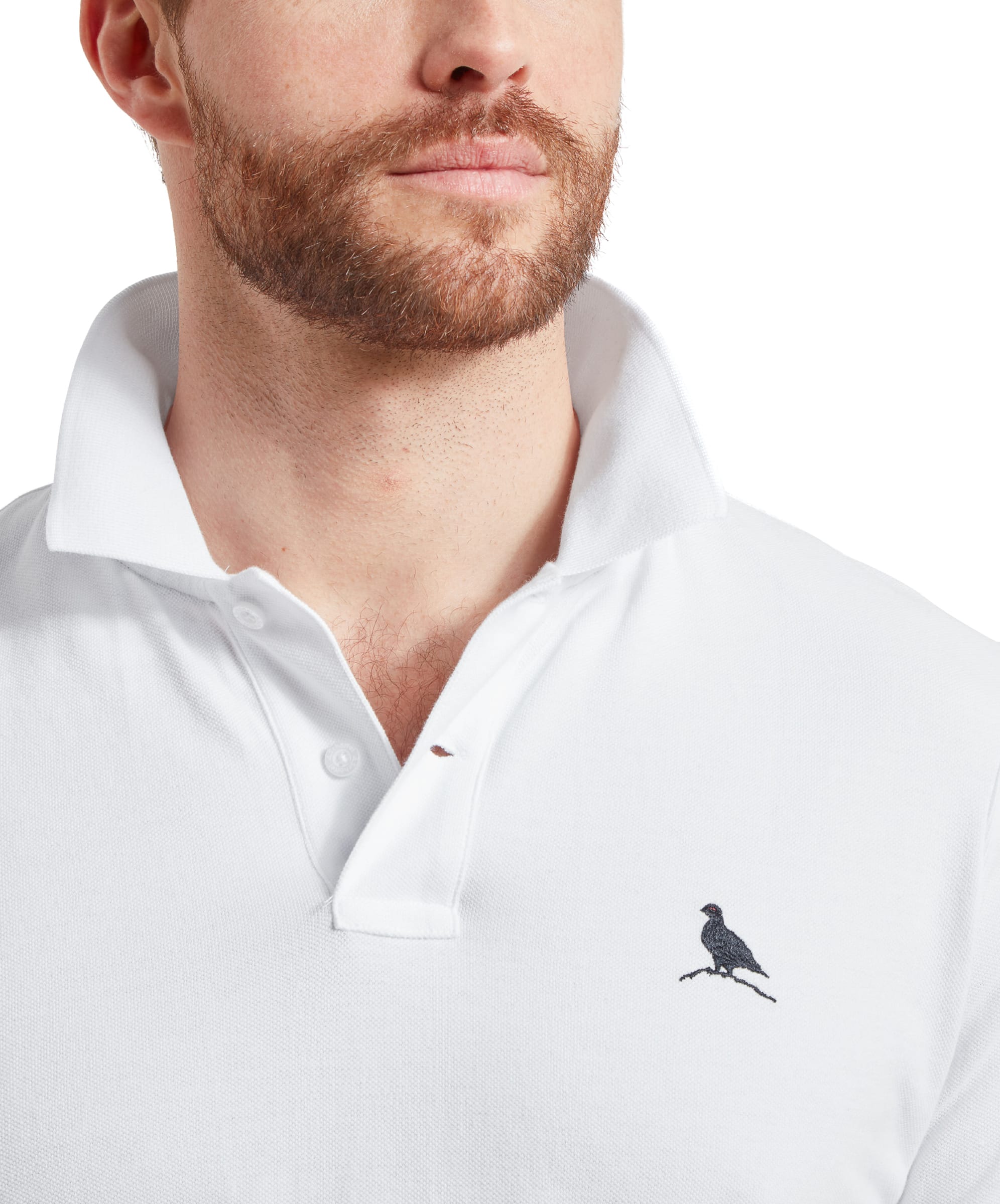 A close-up of the embroidered bird logo on the chest of the Schöffel St Ives Polo Shirt for Men in White, highlighting the fine details.