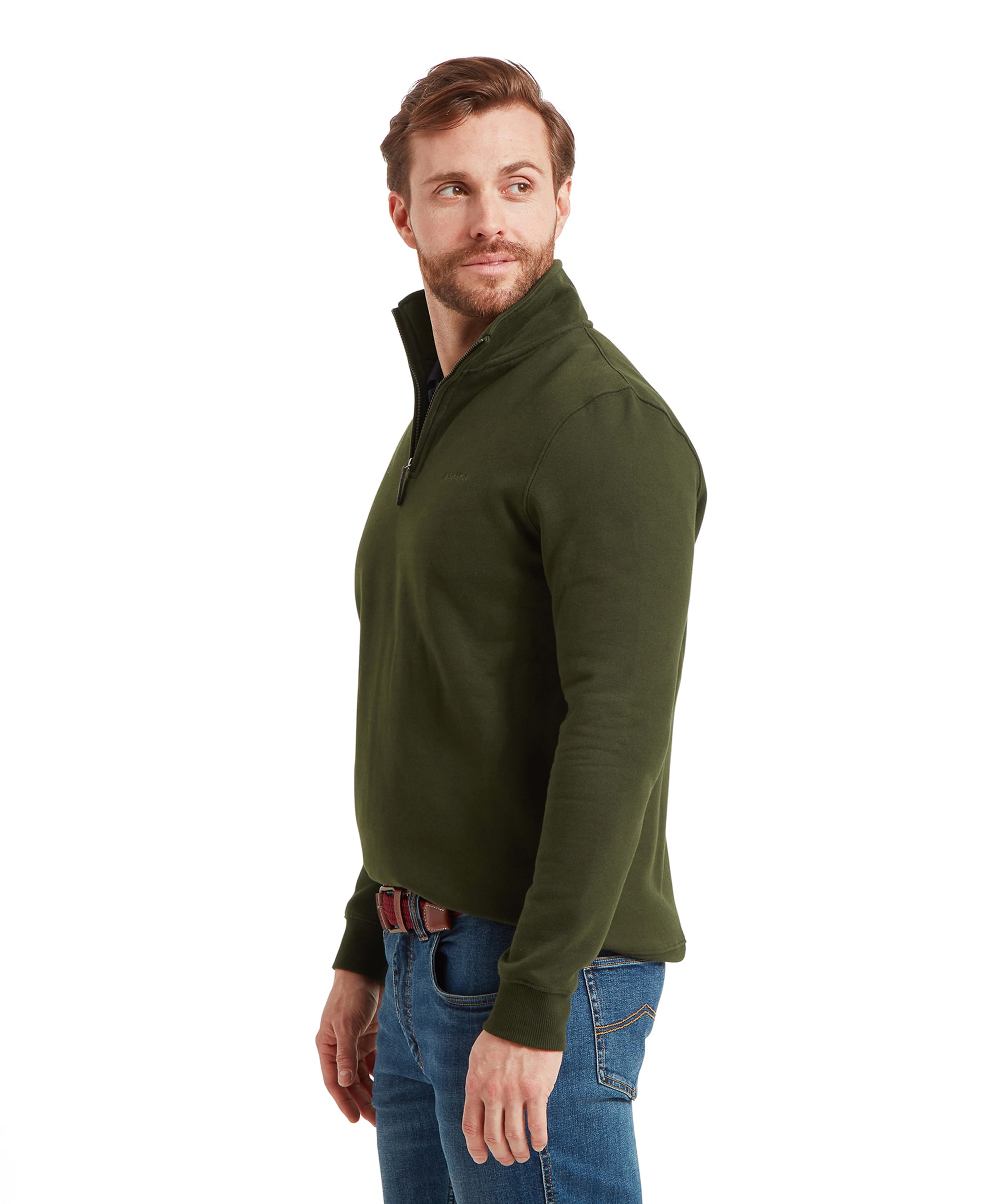 Side view of the man standing, turned slightly to the left, highlighting the Schöffel St Merryn Sweatshirt for Men in Dark Green's fit and design details.