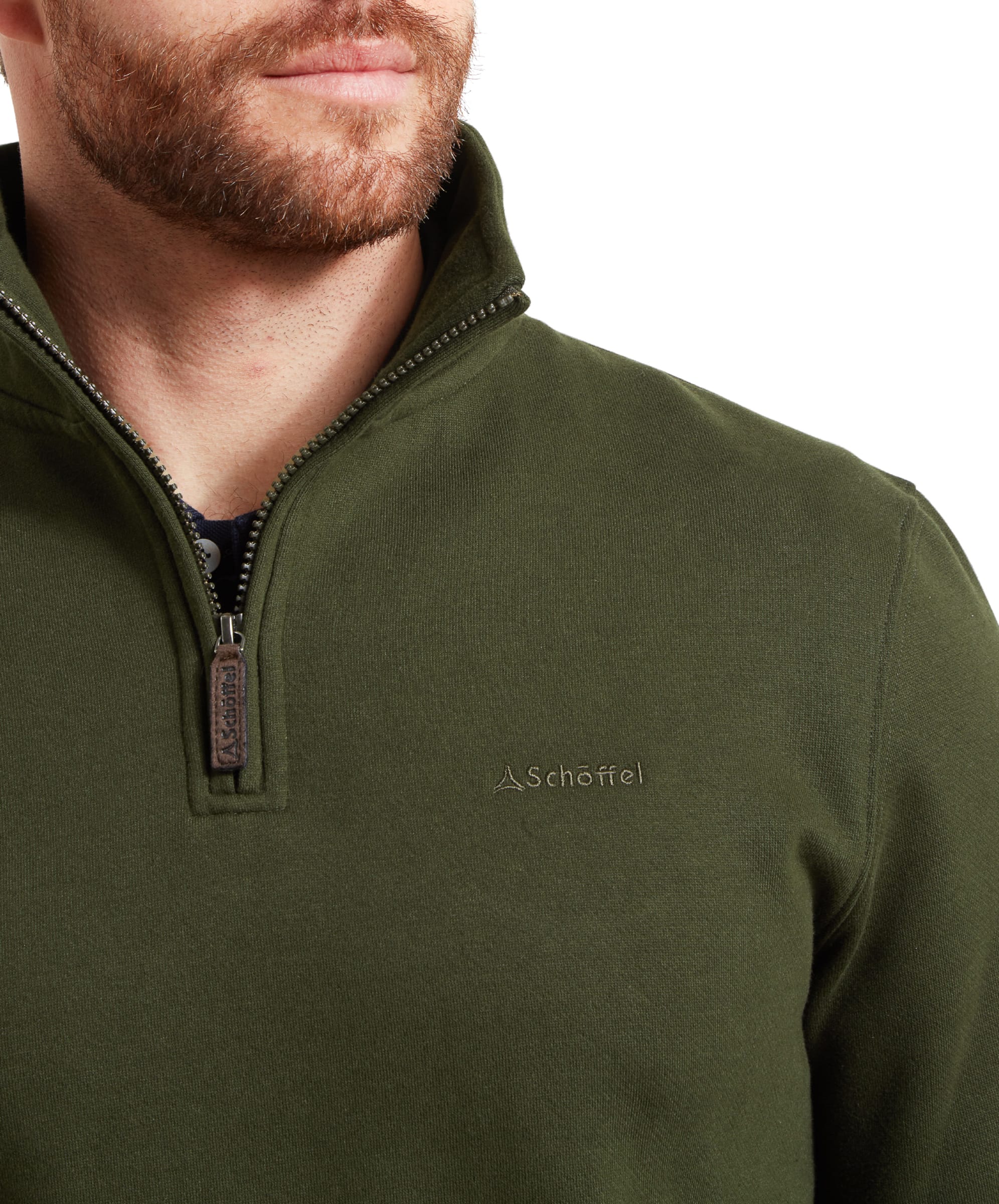 Close-up of the chest area, focusing on the embroidered Schöffel logo and the collar detail of the Schöffel St Merryn Sweatshirt for Men in Dark Green.