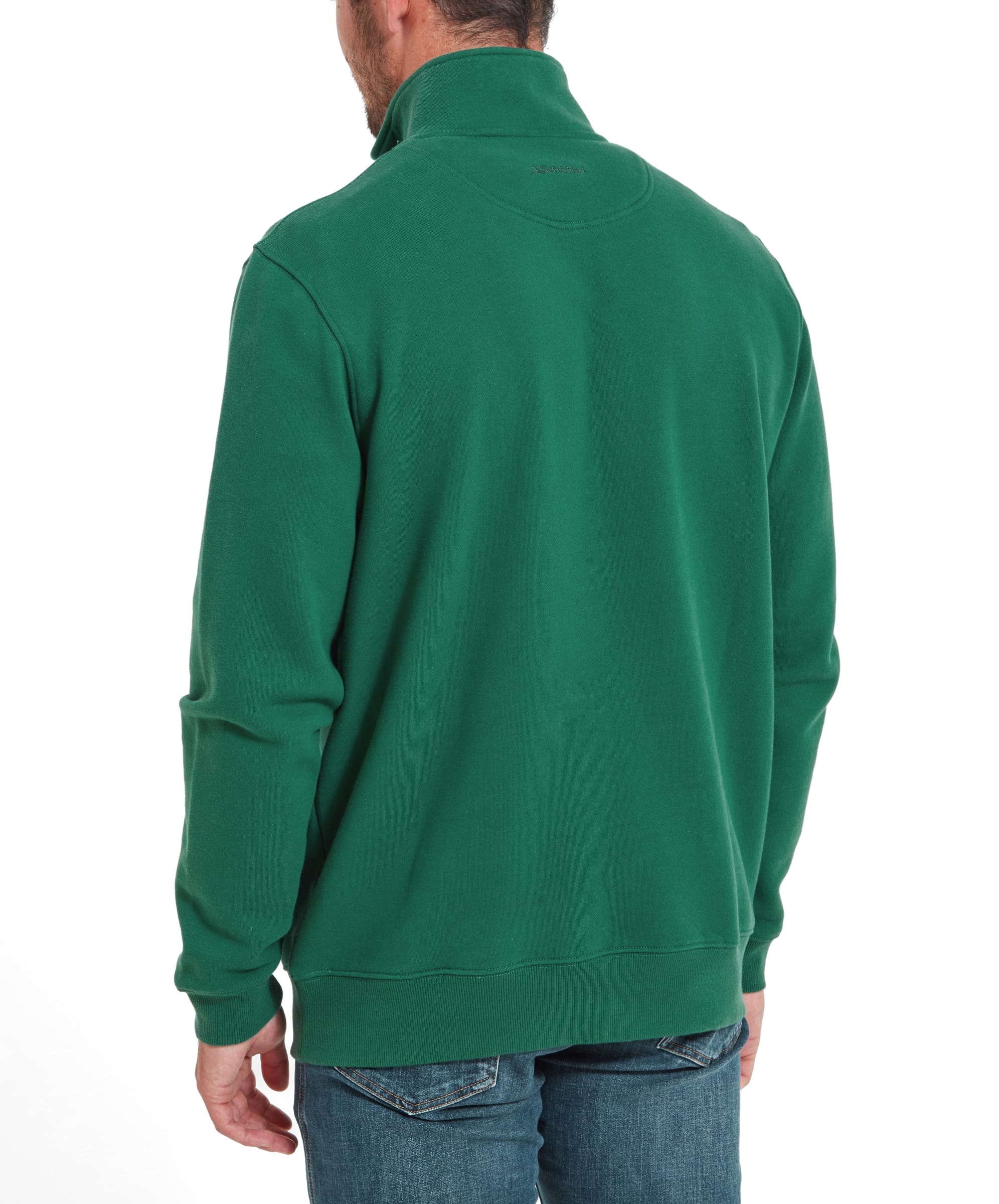 A side view of the man wearing the Schöffel St Merryn Sweatshirt for Men in Green, showing the fit and length of the garment. He is standing and looking over his shoulder, hands by his sides.