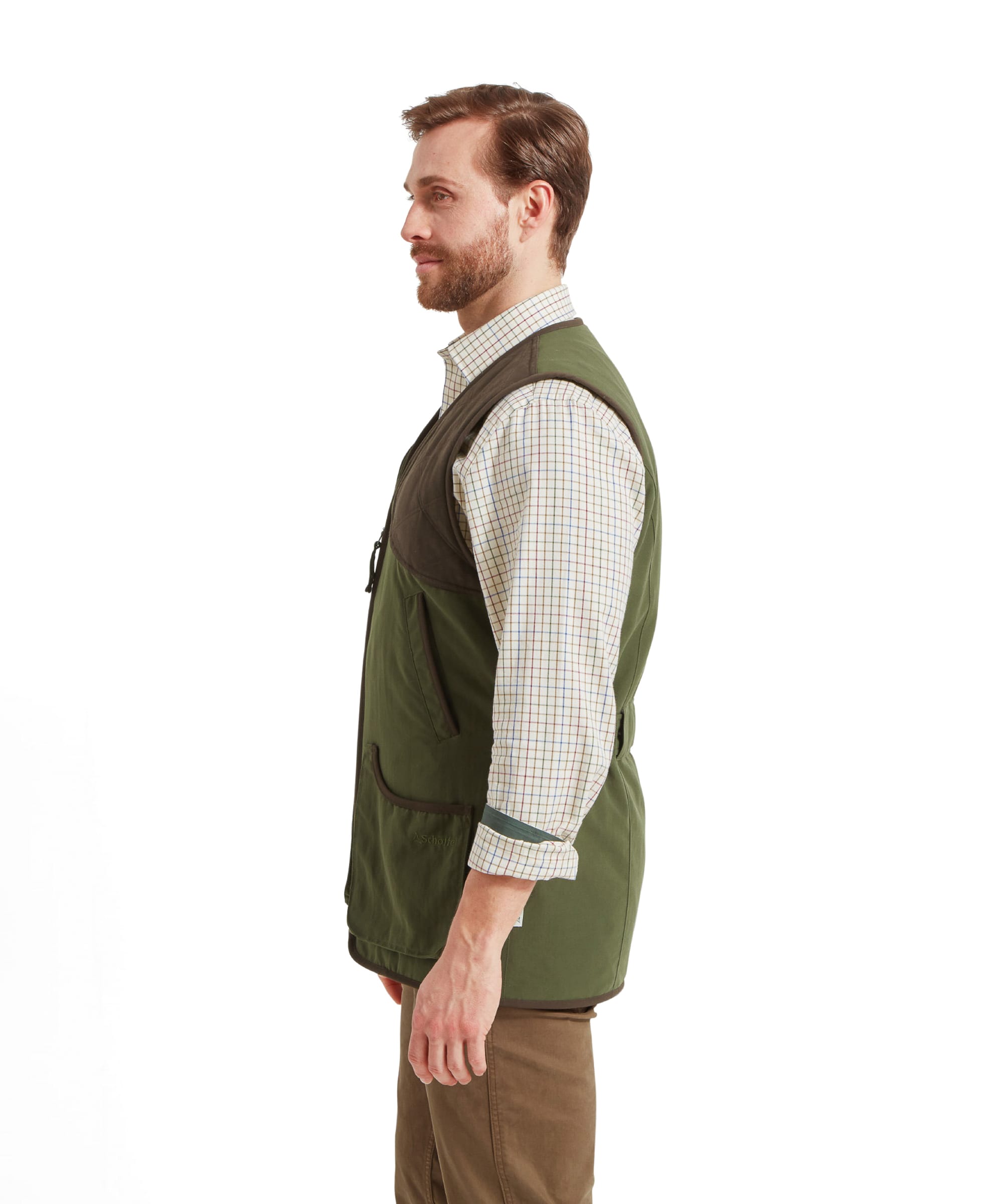 Side view profile of a man wearing the Schöffel Stamford Vest II for Men in Green highlighting the fit and structure.