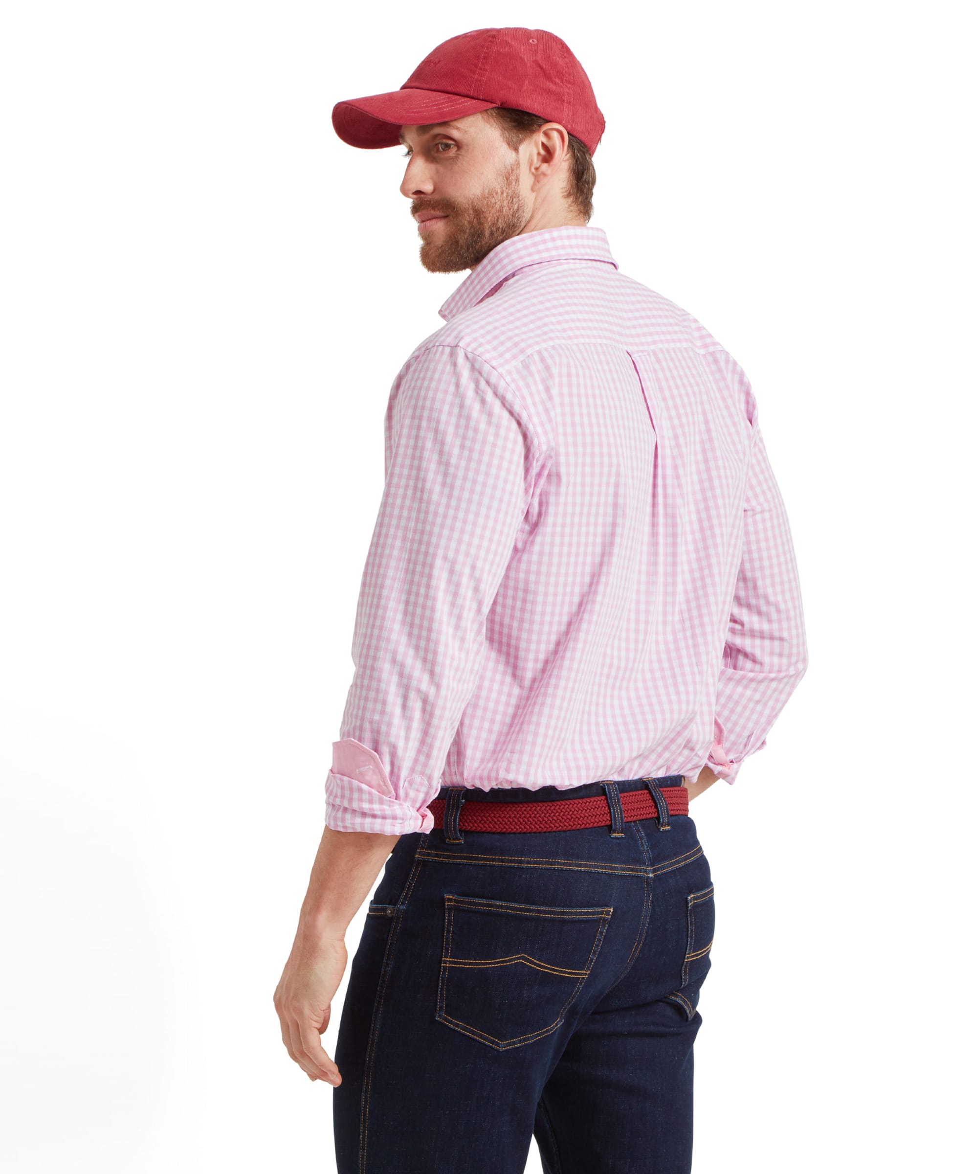 The man is seen from the back, showing the fit of the Schöffel Thorpeness Tailored Shirt for Men in Pink. The shirt features a classic button-down collar and a curved hemline.