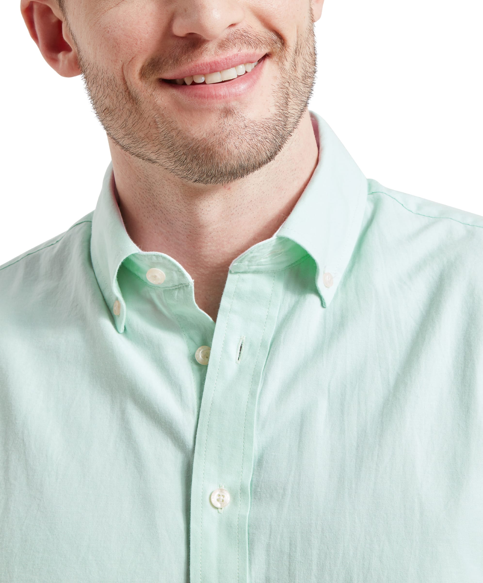 Close-up of the man's face and the collar of the Schöffel Titchwell Tailored Shirt for Men in Green, showing a button-down collar and a casual smile.