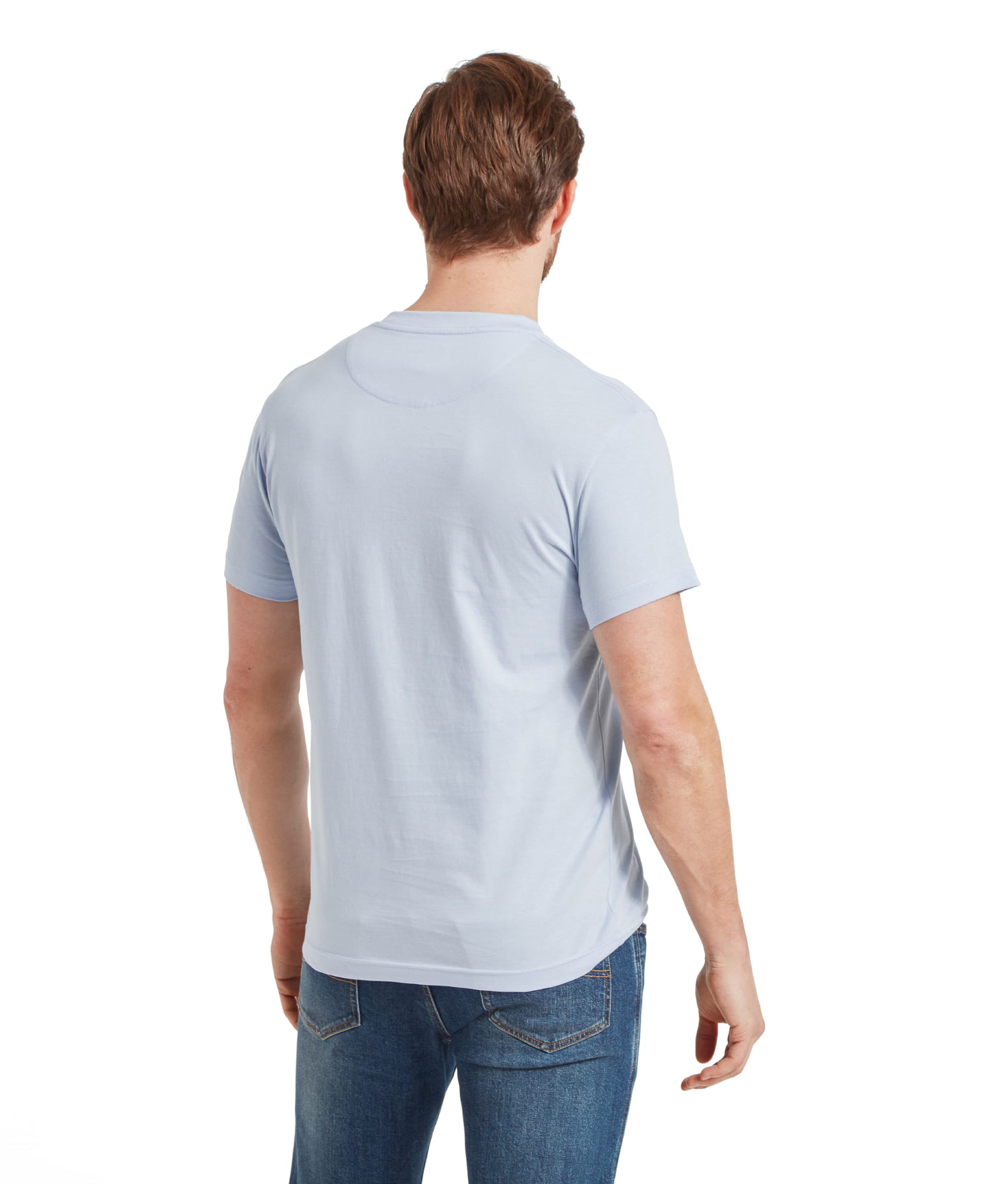 The back view of the man, highlighting the fit and cut of the Schöffel Trevone T-Shirt for Men in Blue, paired with jeans.