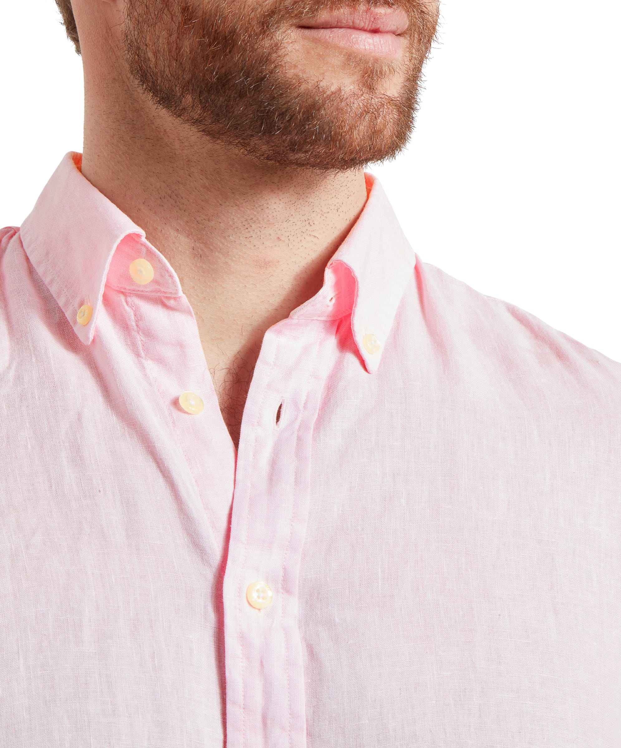 A close-up of the Schöffel Walsingham Linen Shirt for Men in Pink's collar area, showing the fine details of the button-down collar and the quality of the linen fabric. The buttons are in a contrasting color, adding a subtle detail to the shirt.