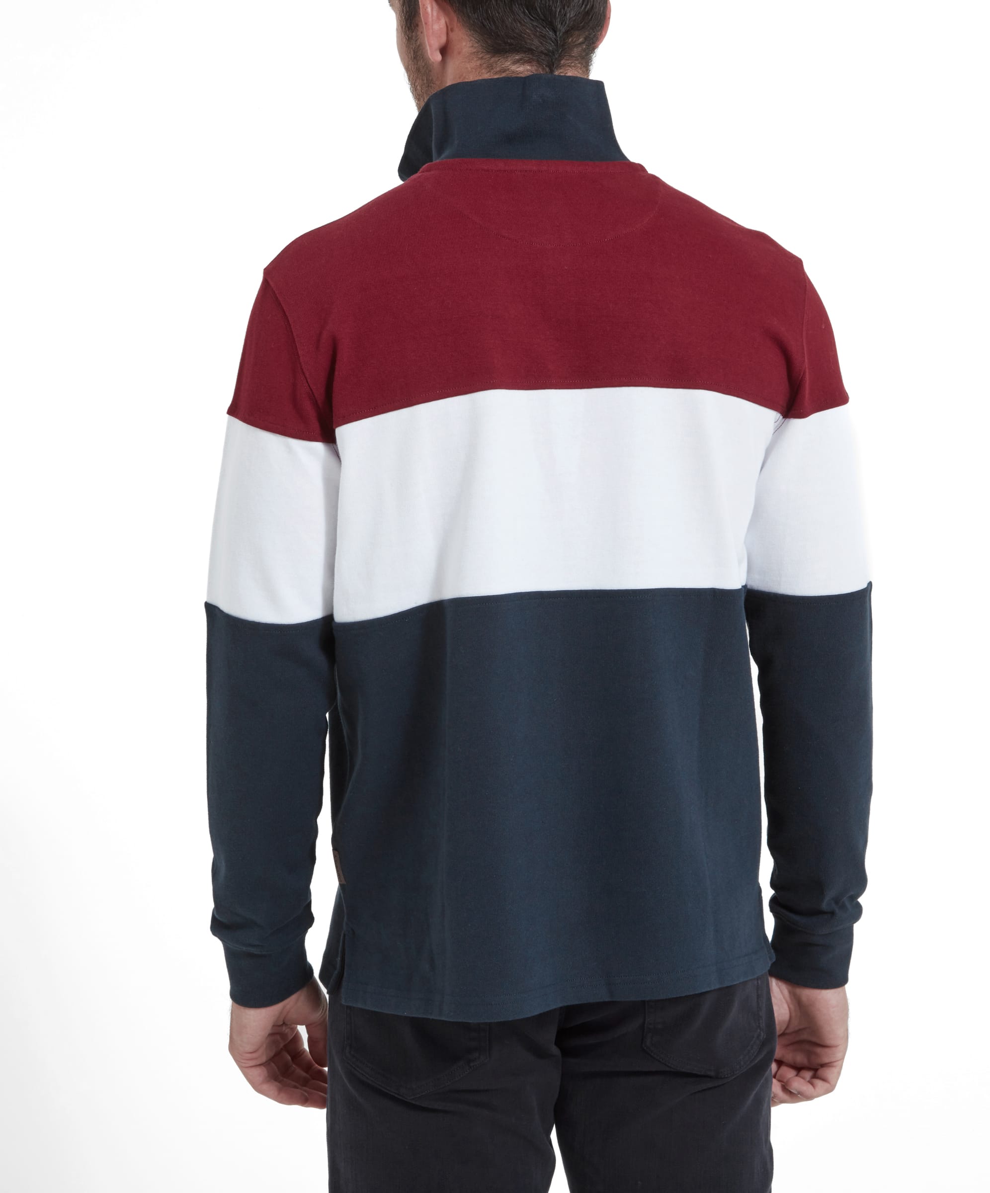 The fourth image shows the back view of the man wearing the Schöffel Exeter Heritage 1/4 Zip for Unisex in Red, revealing the color block pattern in maroon, white, and navy blue.