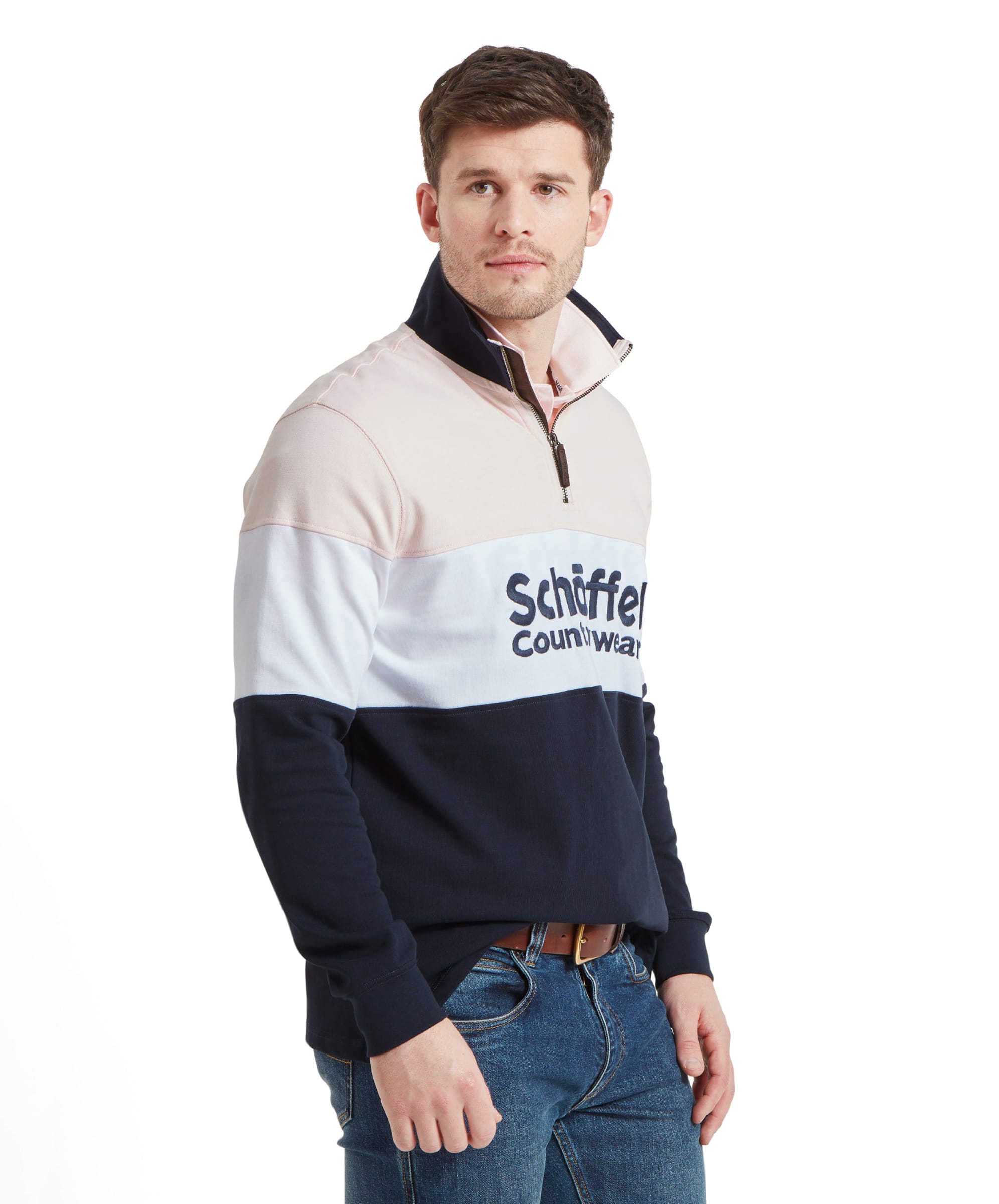 Close-up of the man's upper body, showcasing the Schöffel Exeter Heritage 1/4 Zip for Unisex in Pale Pink's details and the Schöffel logo on the chest.