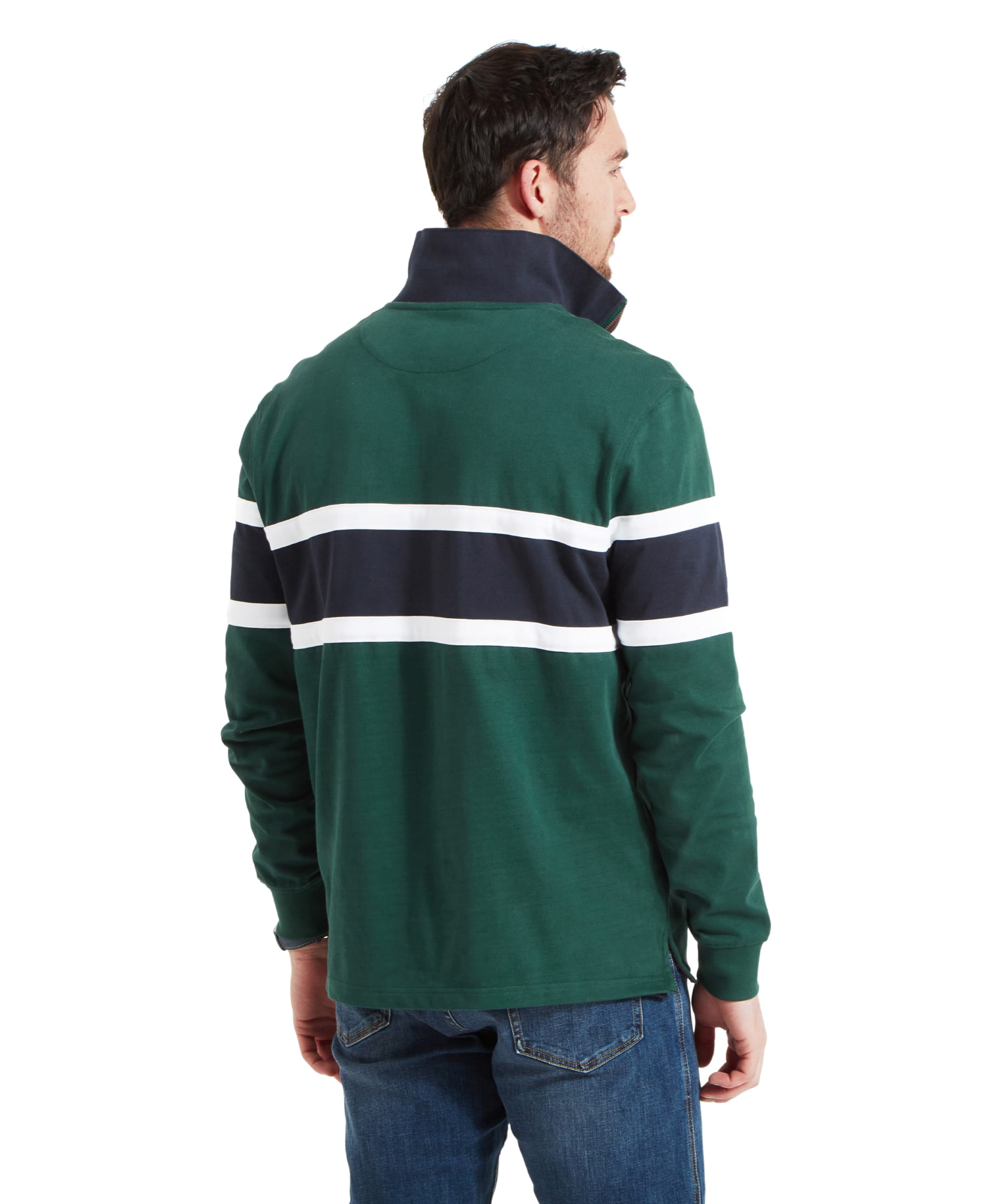 The back view of the man in the Schöffel Exmouth Heritage 1/4 Zip for Unisex in Green, showing the white and navy stripes on the back, with his hands in his pockets.