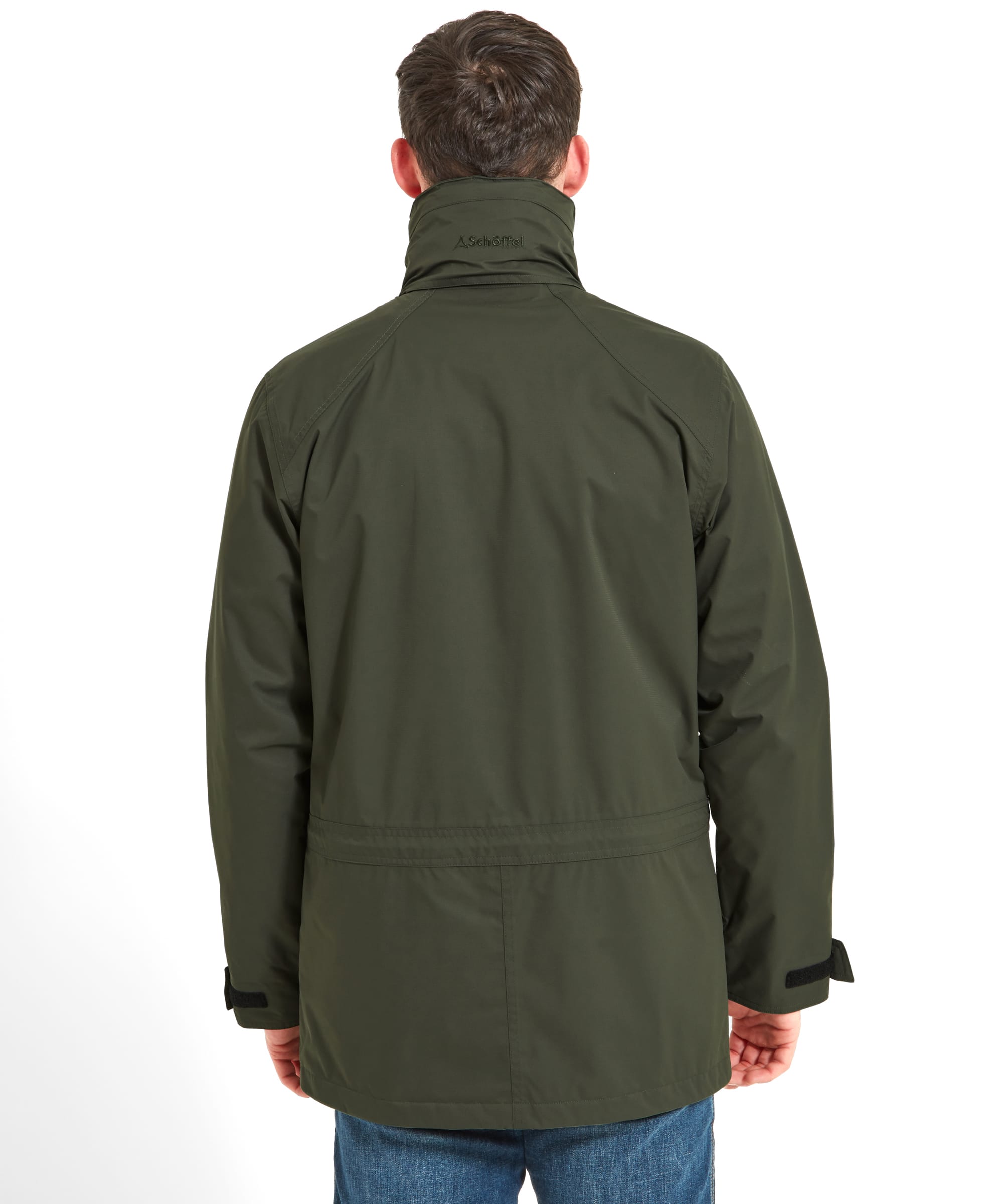 Rear view of the man wearing the Schöffel Unisex Ketton Jacket II in Green, showing the back details of the jacket.