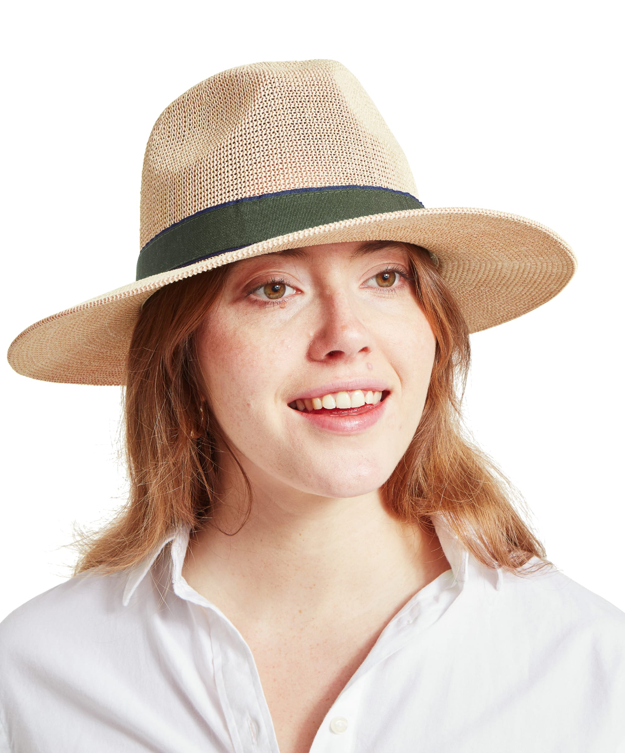 A close-up of a woman wearing a Schöffel Unisex Porth Hat in Green. She has light brown hair and is smiling, wearing a white shirt.