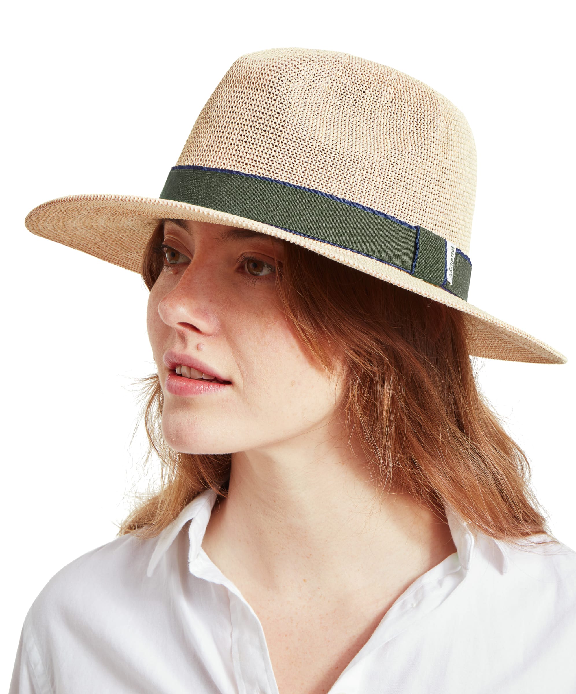 A side profile of a woman wearing a Schöffel Unisex Porth Hat in Green. She is looking to the left, showing the details of the hat's brim and band.