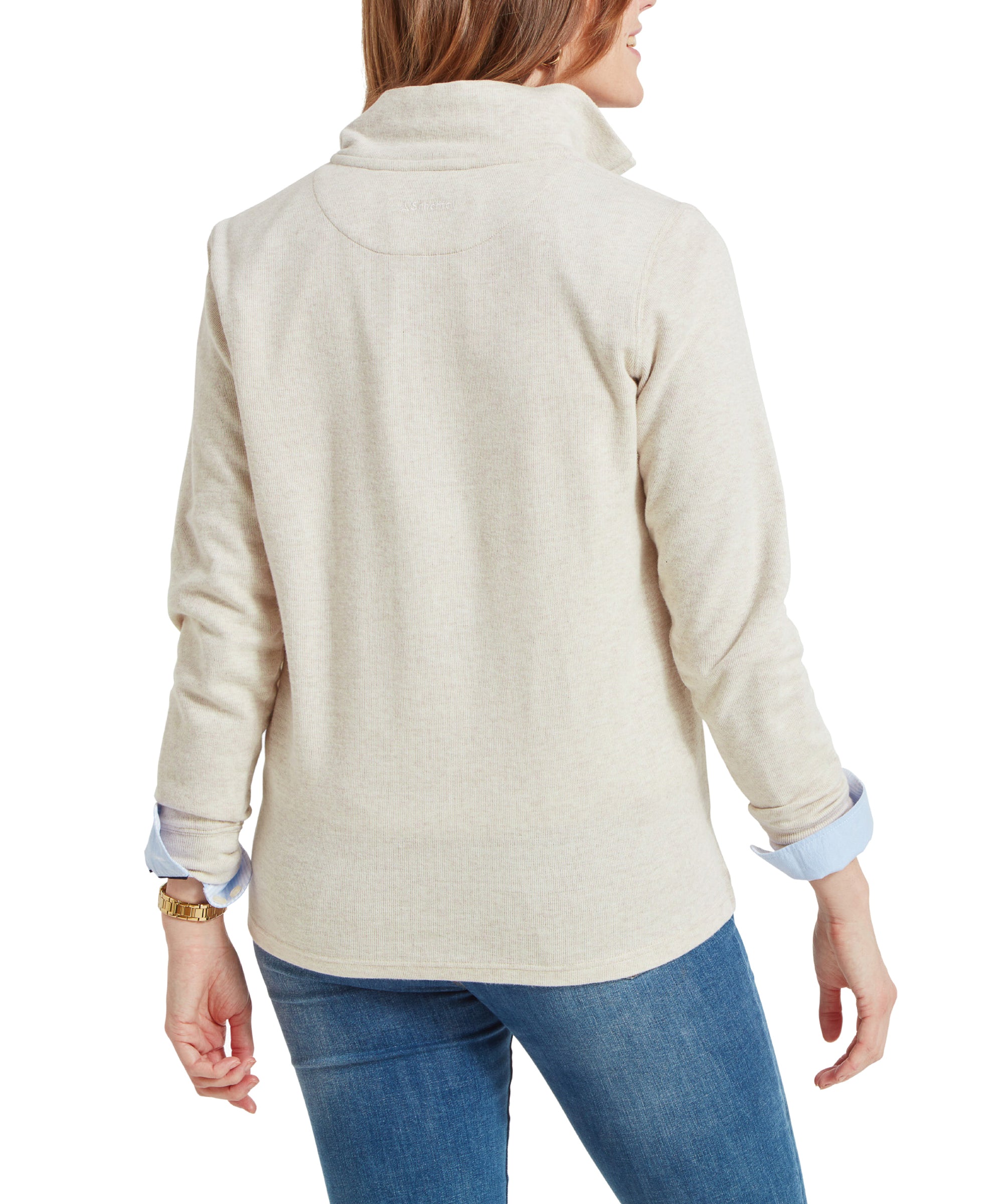 A model wearing a Schöffel Appletree Bay 1/4 Zip for Women in Light Brown over a blue collared shirt and blue jeans, viewed from the back.