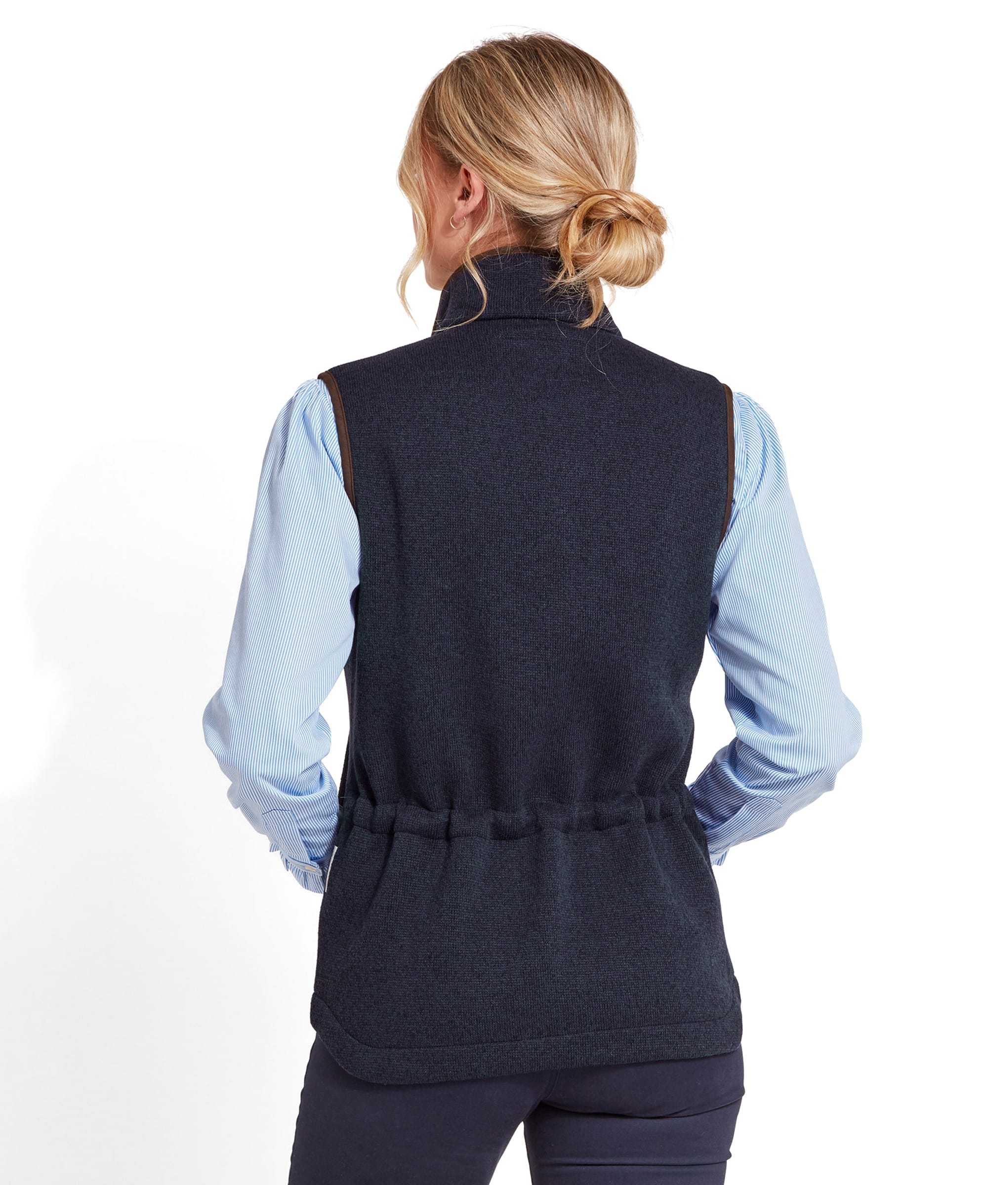 Rear view of a woman wearing a Schöffel Ashton Gilet for Women in Blue, showing the back of the gilet and the gathered waist detail.