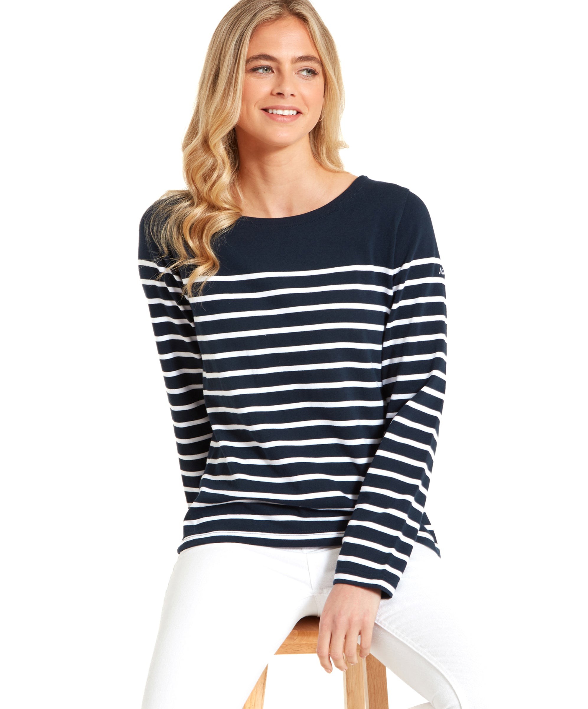 Woman wearing a Schöffel Beauport Top for Women in Navy and white jeans.